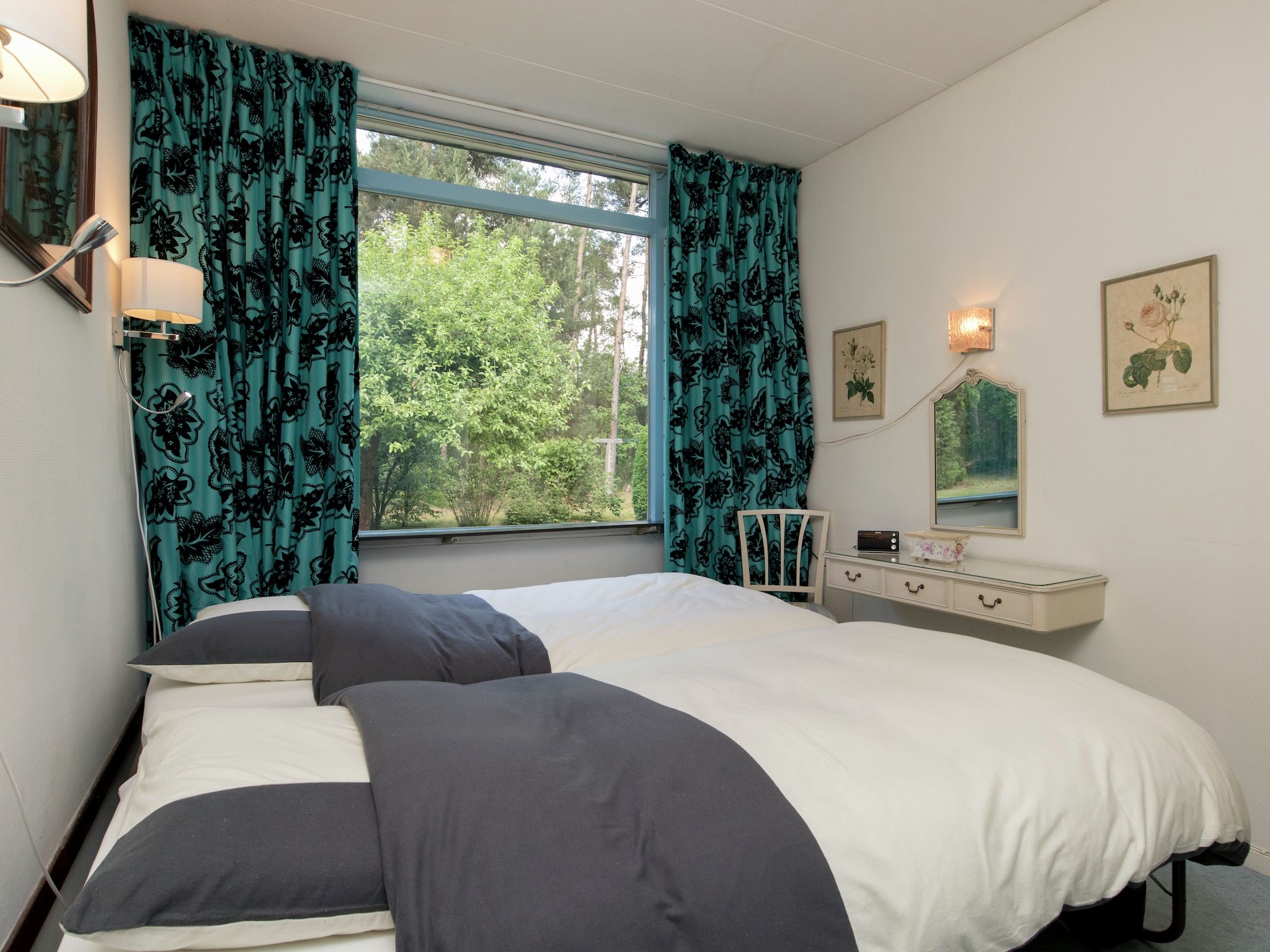 Een slaapkamer van Ruischende Dennen in Huybergen