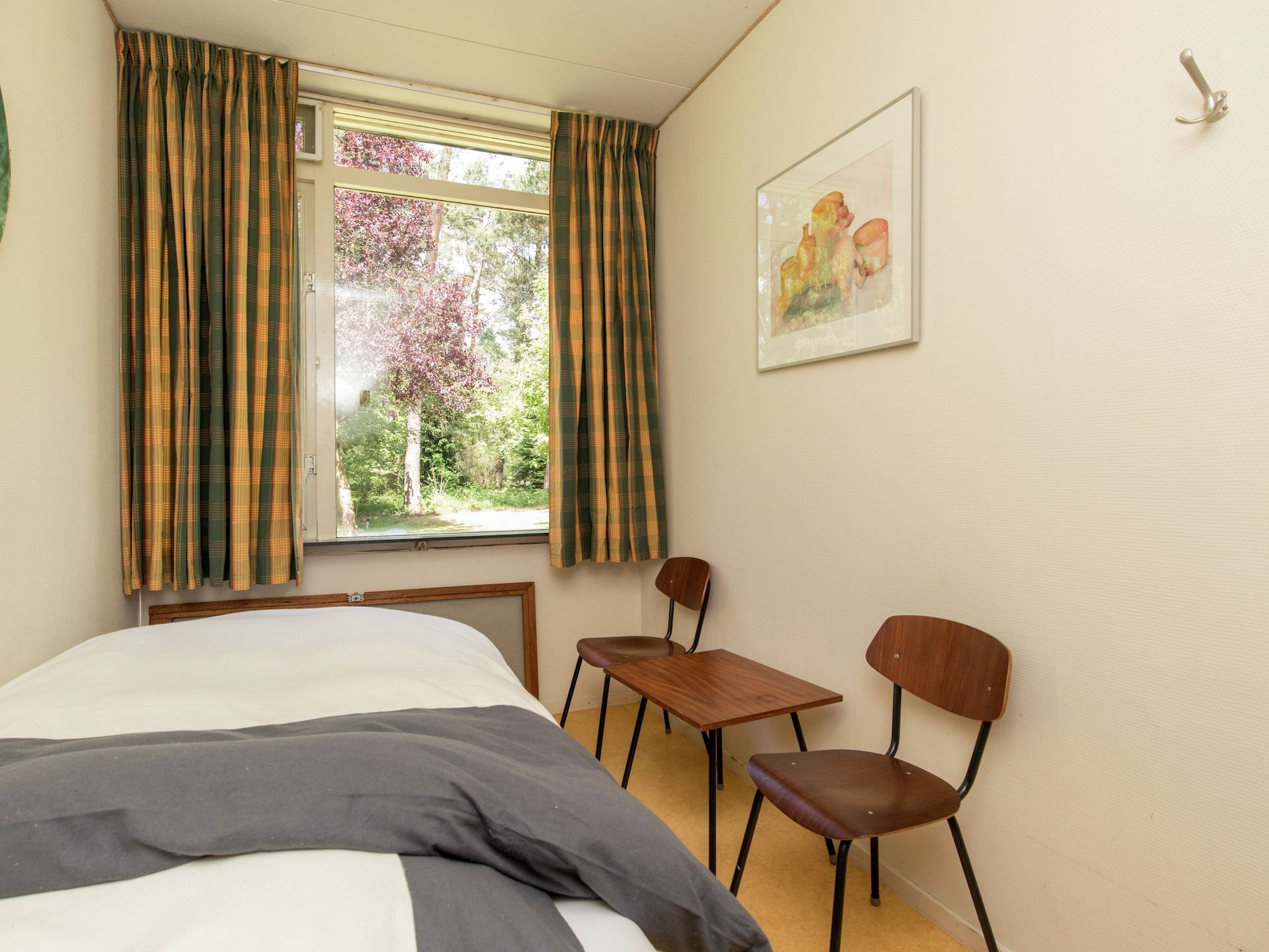 Een slaapkamer van Ruischende Dennen in Huybergen