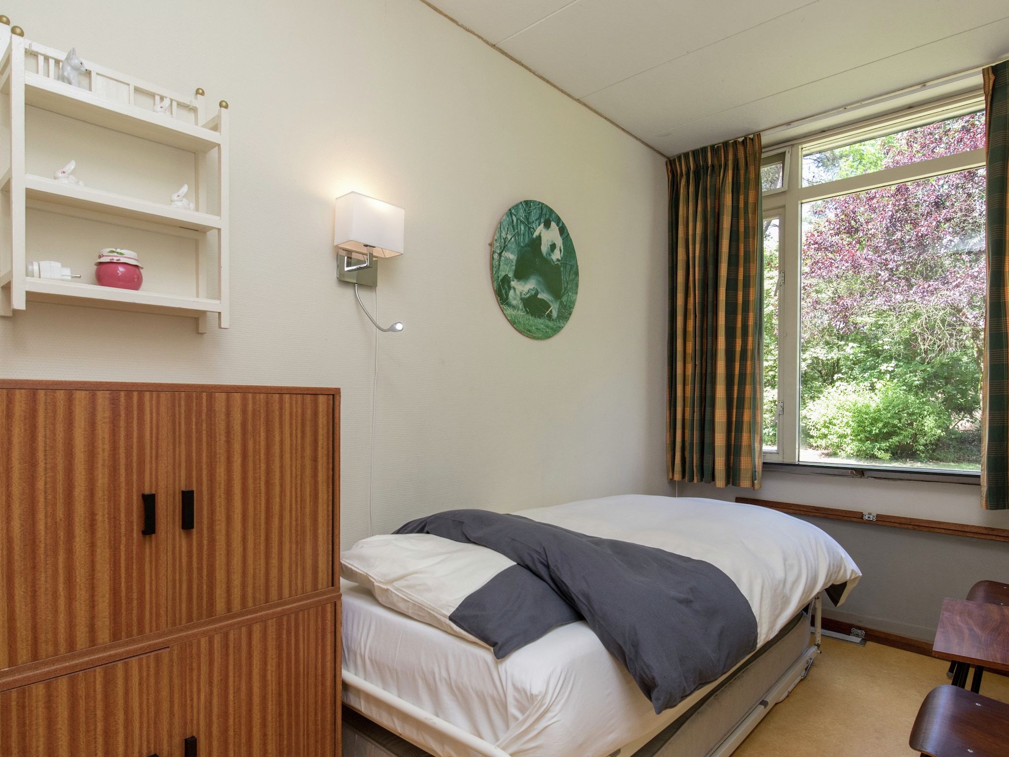 Een slaapkamer van Ruischende Dennen in Huybergen