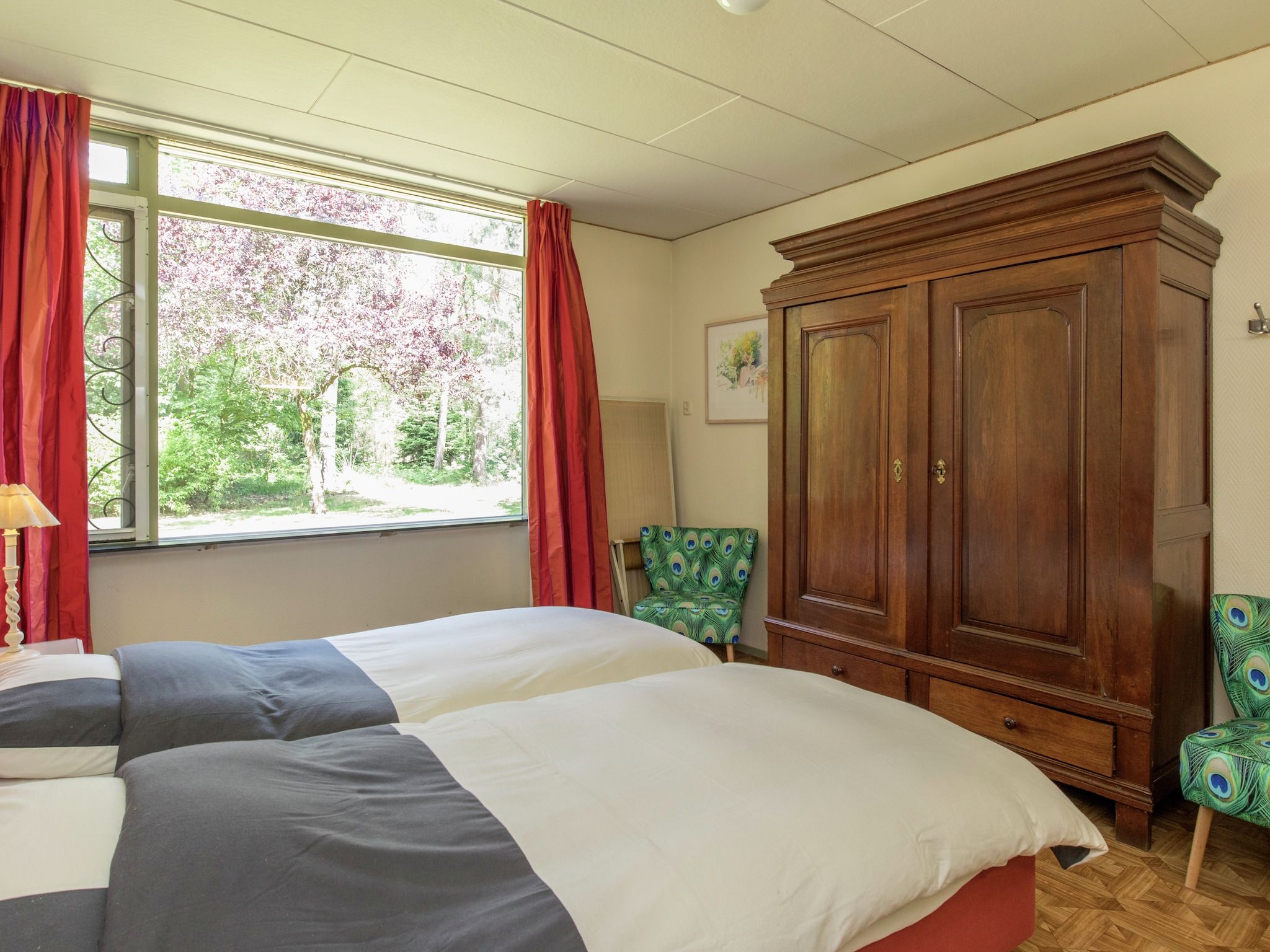 Een slaapkamer van Ruischende Dennen in Huybergen