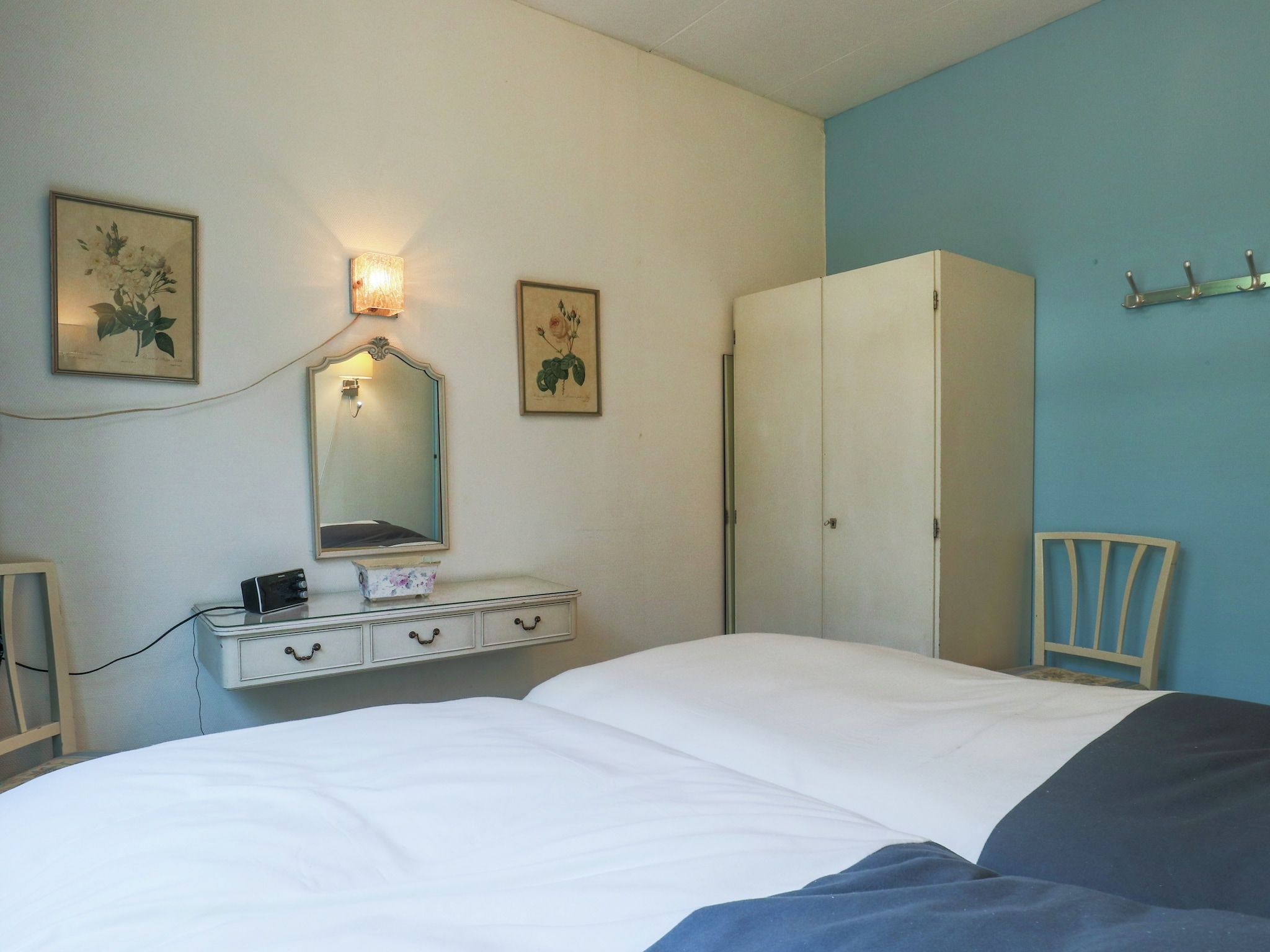 Een slaapkamer van Ruischende Dennen in Huybergen