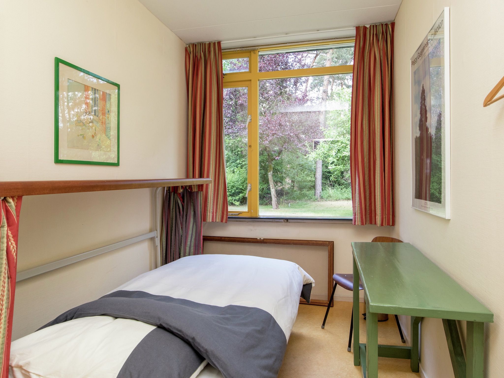 Een slaapkamer van Ruischende Dennen in Huybergen