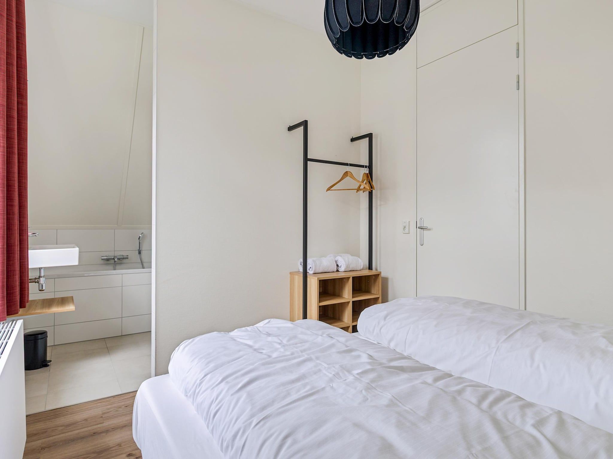 Een slaapkamer van Koggehuys Binnen in PS Opperdoes