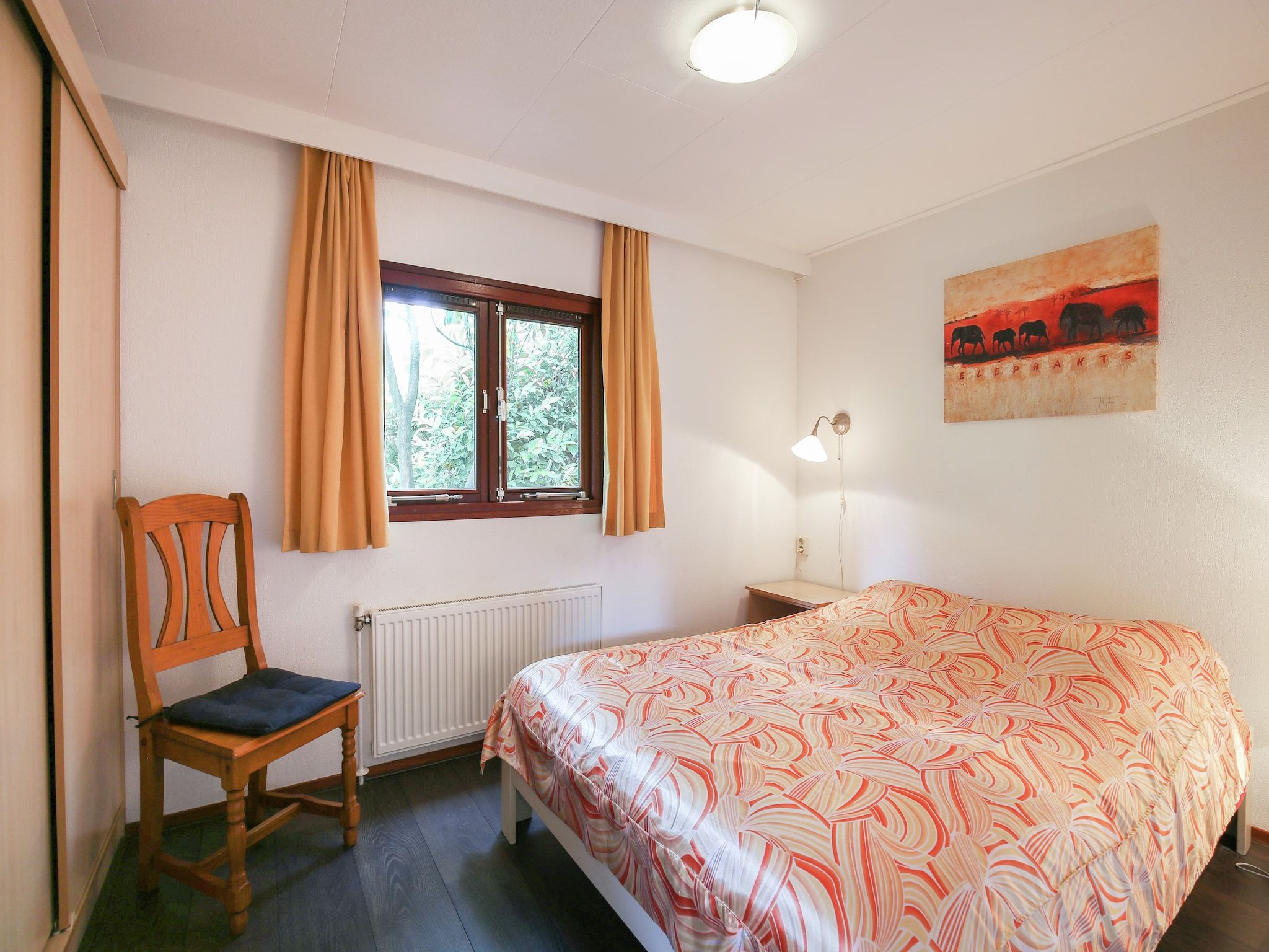 Een slaapkamer van Huisje Arti in Ommen- Stegeren