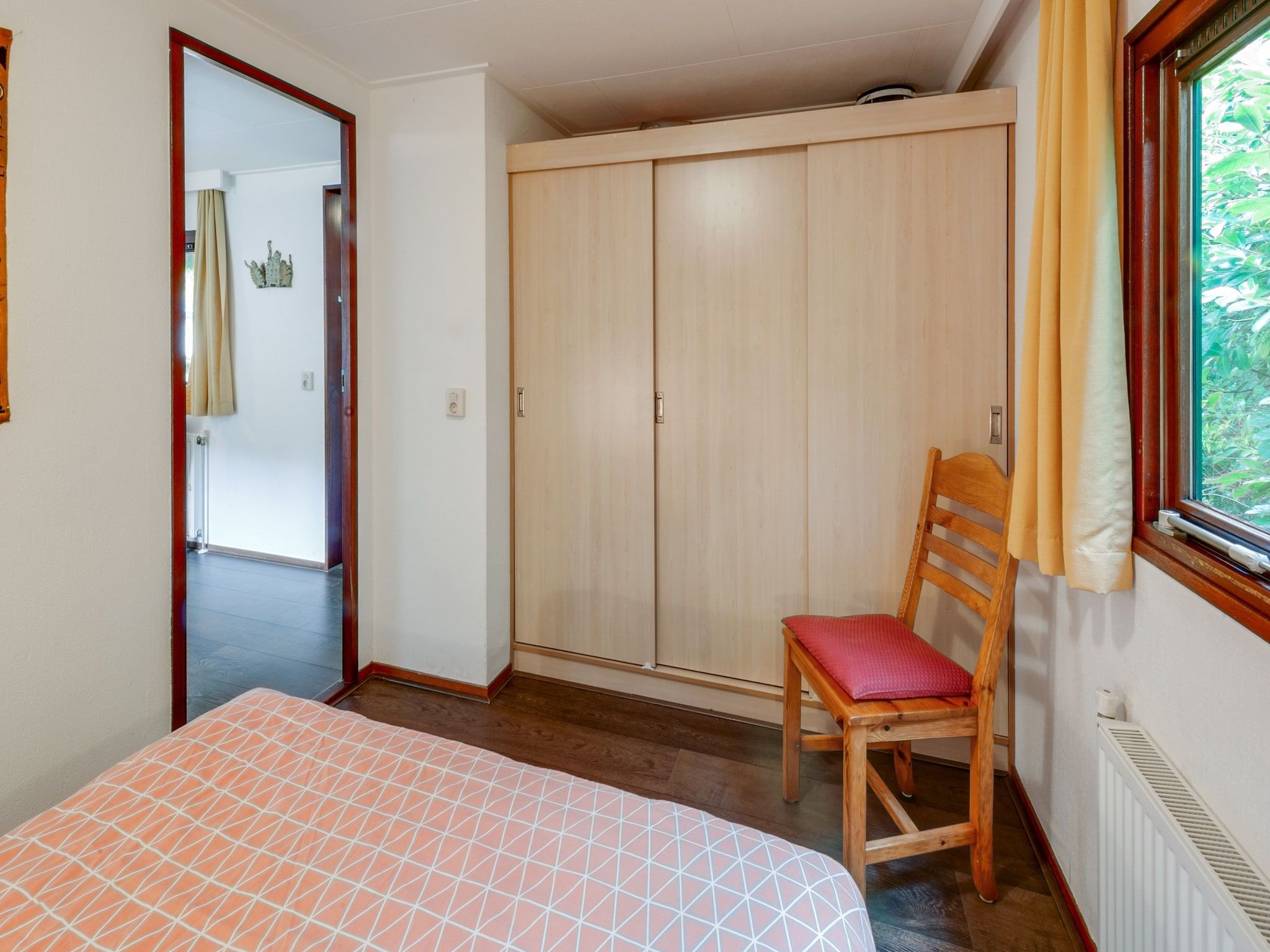 Een slaapkamer van Huisje Arti in Ommen- Stegeren