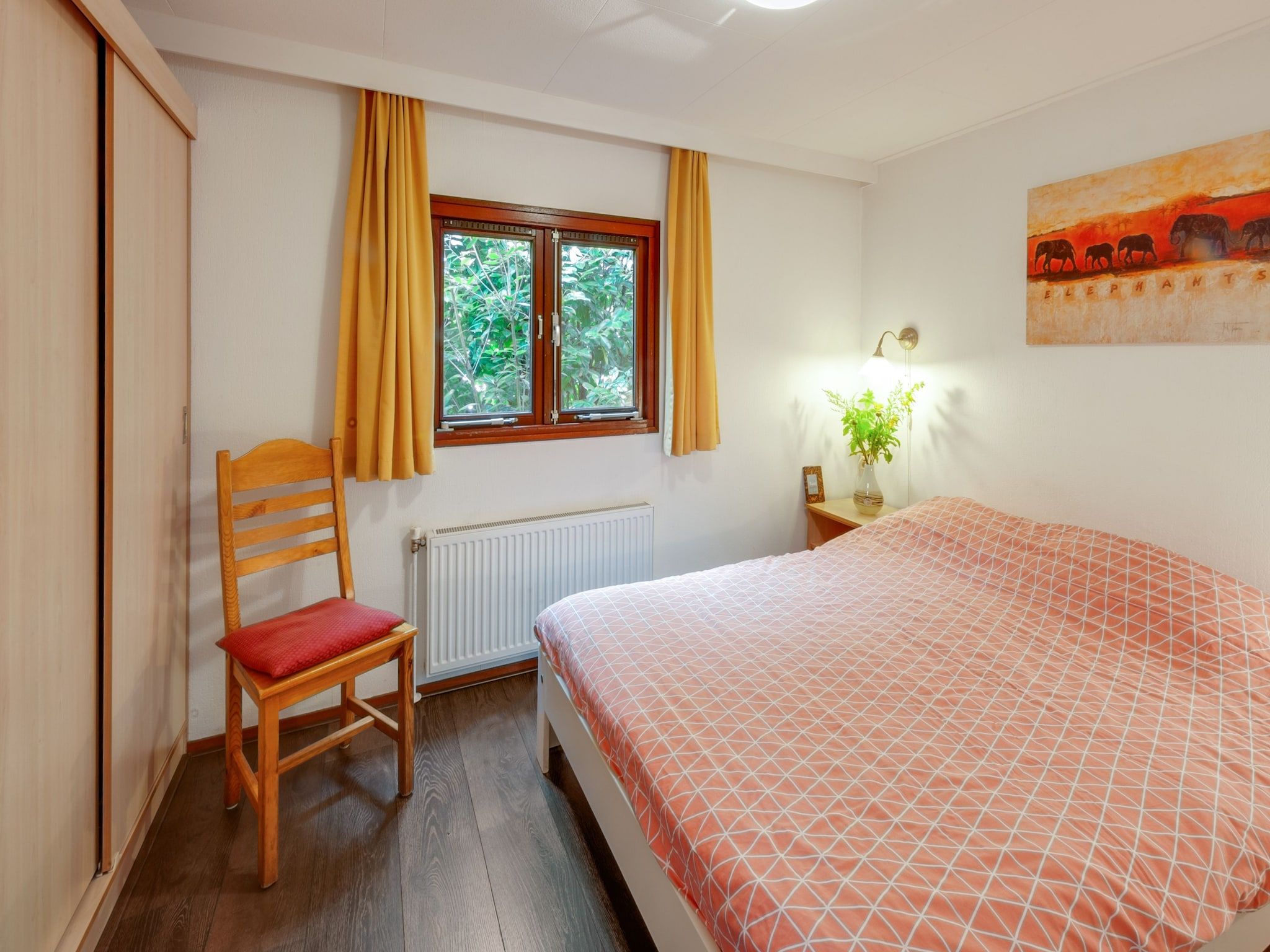 Een slaapkamer van Huisje Arti in Ommen- Stegeren