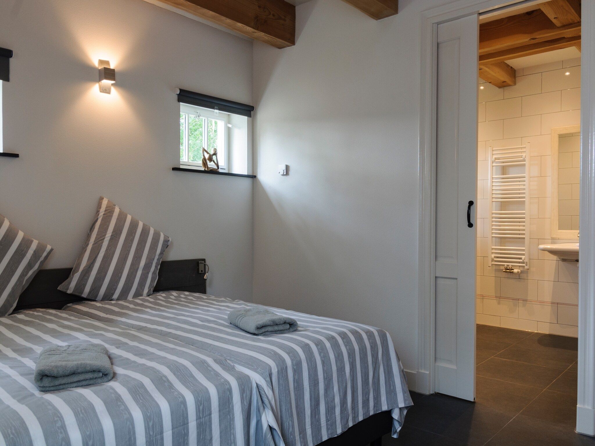 Een slaapkamer van Groepsaccomodatie - Balkenhoeve in Schagen