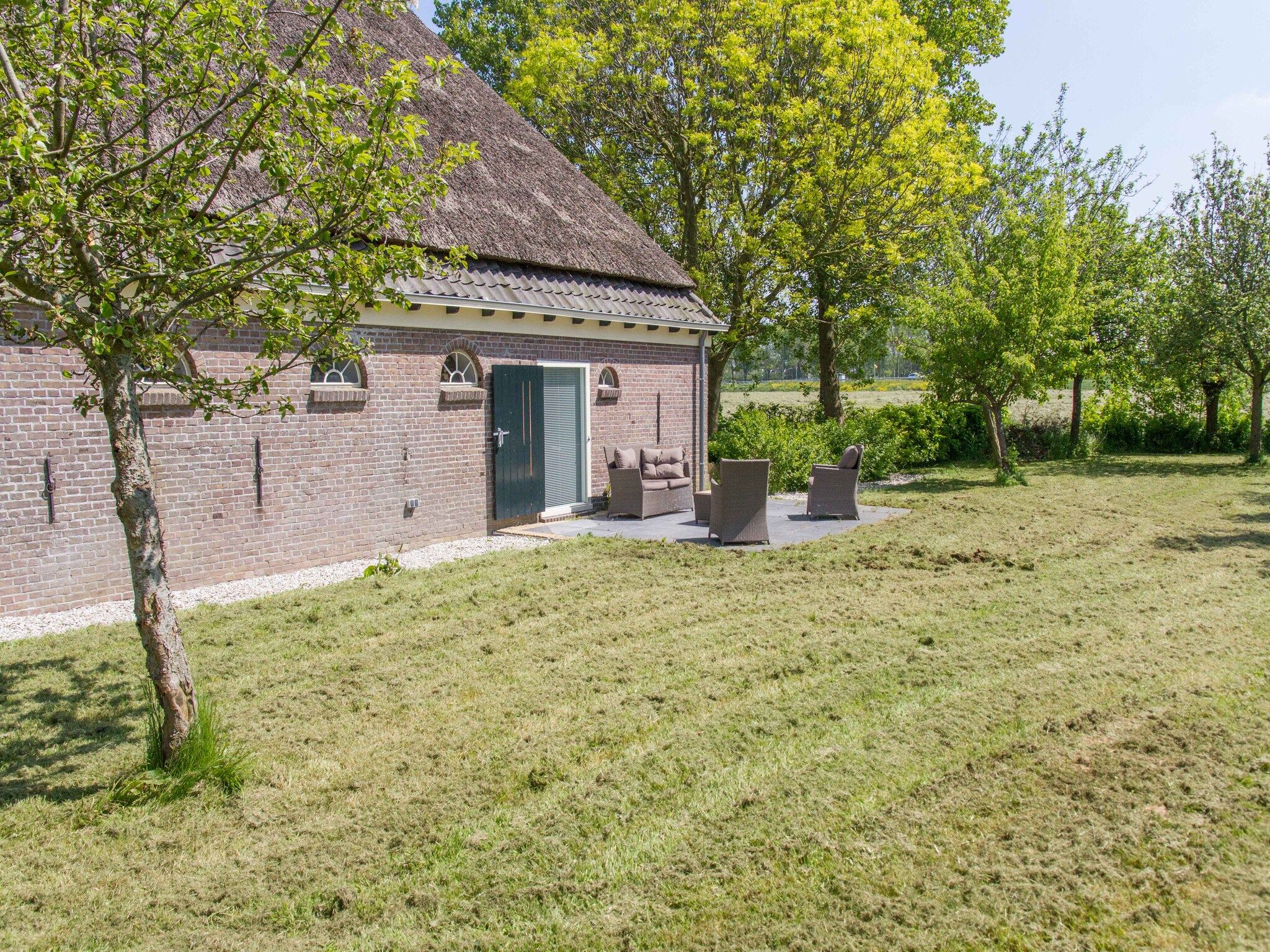 De tuin van Appartement Boerderij in Schagen