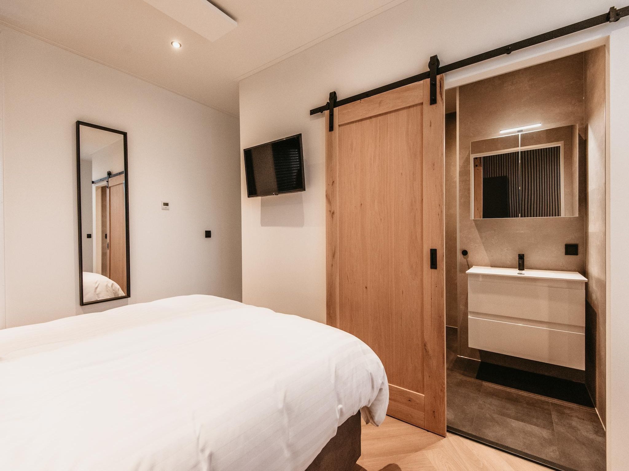 Een slaapkamer van Chalet aan het Water - Betuwse Hofjes - 4 pax December in Kesteren