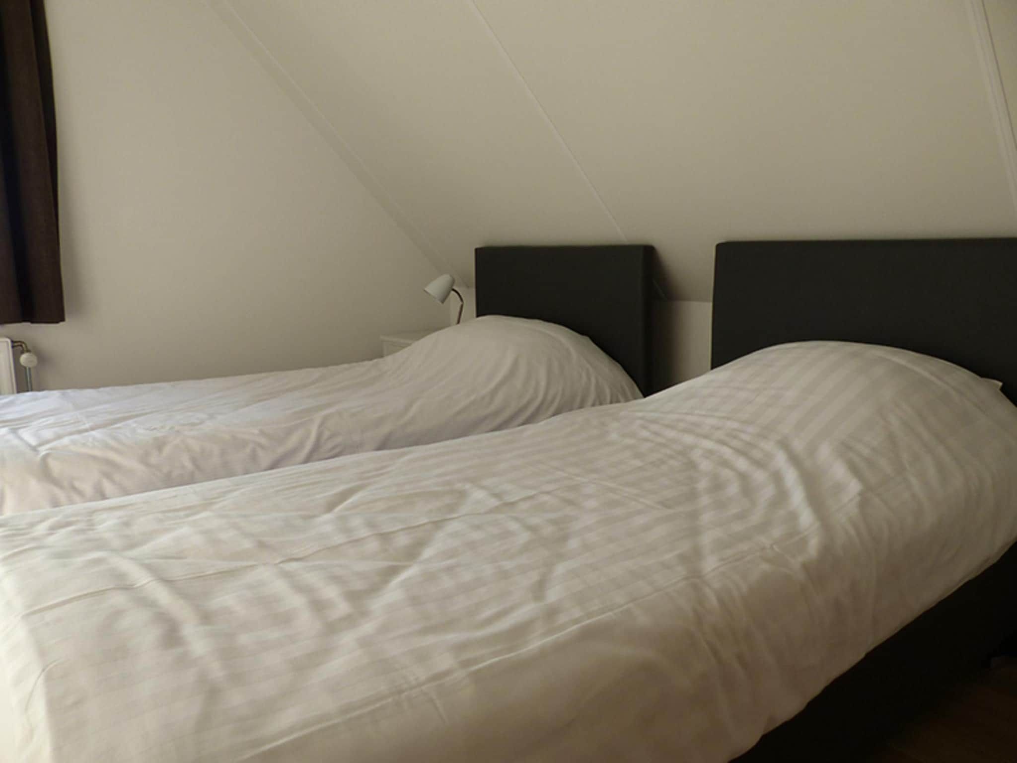 Een slaapkamer van Villa de Hertog 722 in Baarle-nassau