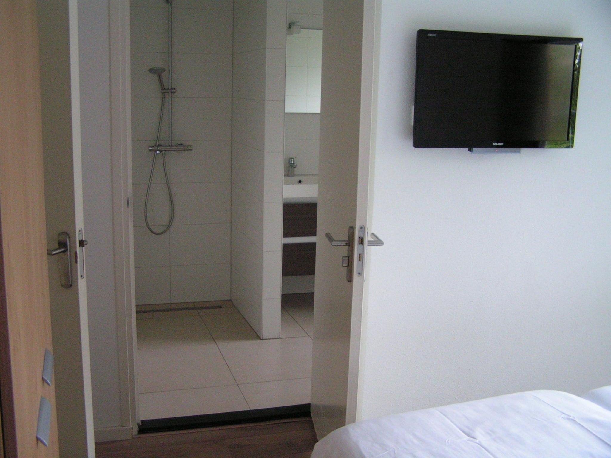 Een slaapkamer van Villa de Hertog 722 in Baarle-nassau