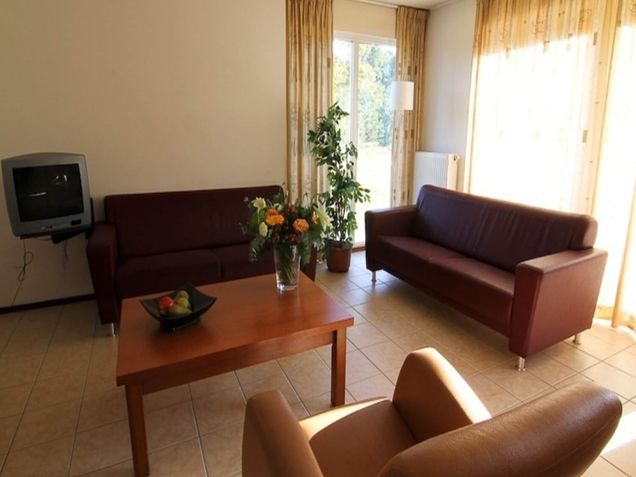 De woonkamer van Boswoning in Heel