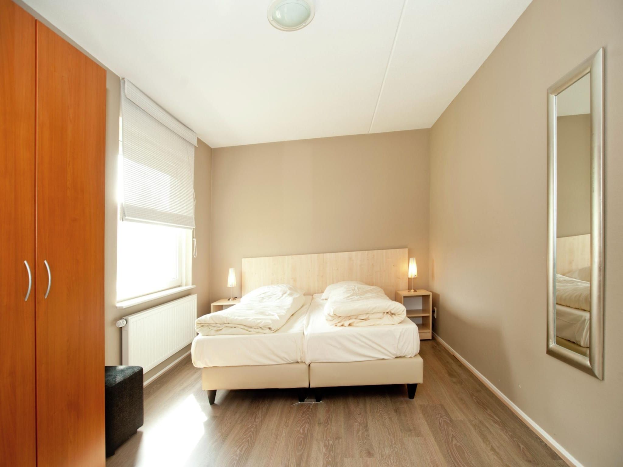 Een slaapkamer van Boswoning in Heel