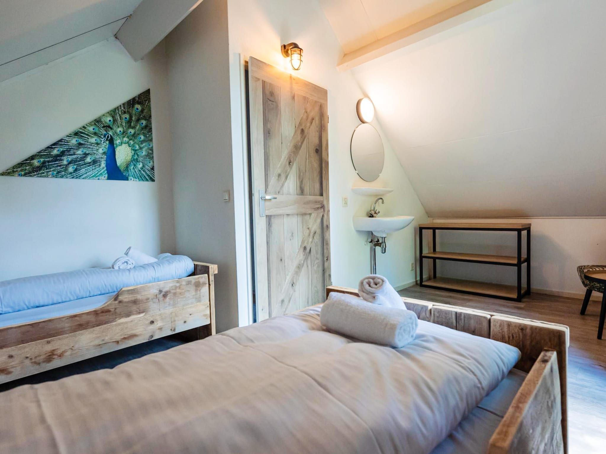 Een slaapkamer van 6 - Persons Lakeside Child-friendly Bungalow in Ewijk