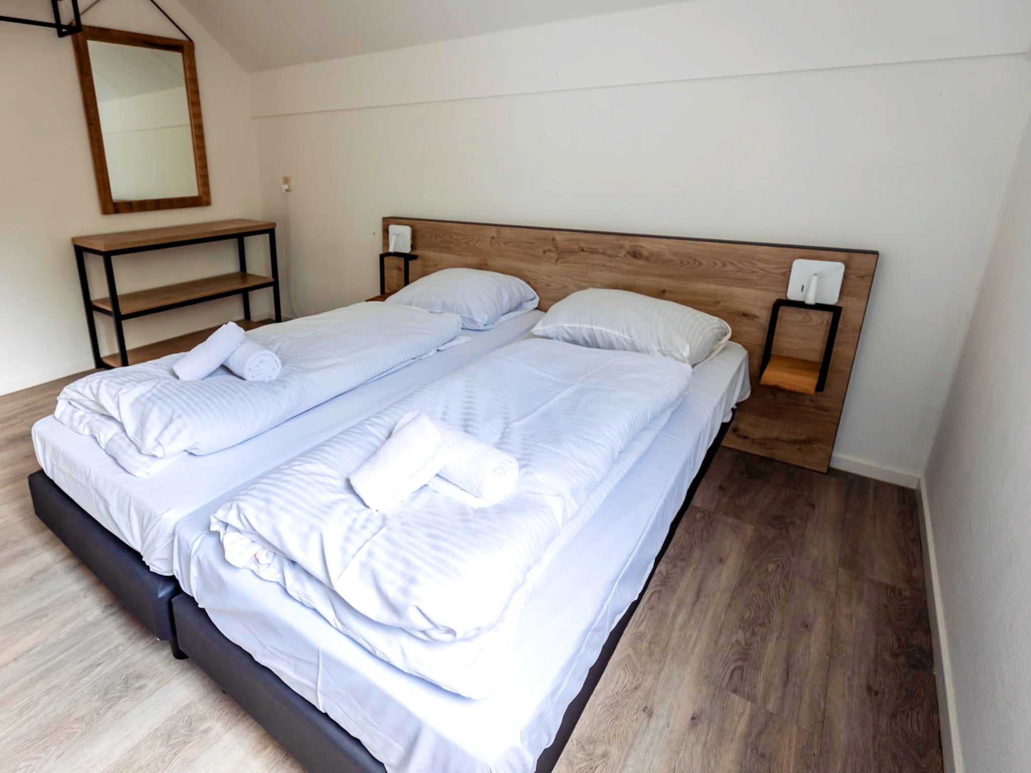 Een slaapkamer van 8 - Persons Family bungalow in Ewijk