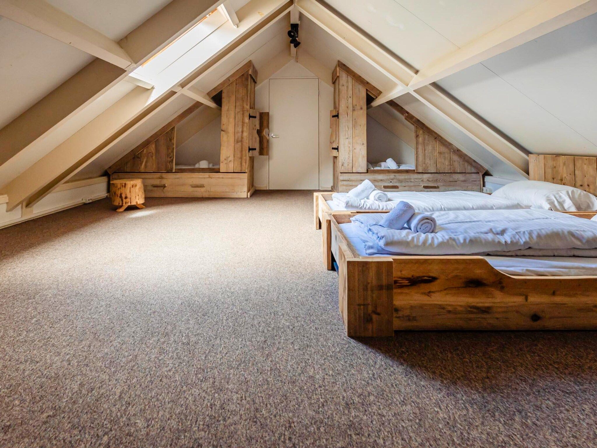 Een slaapkamer van 16 - Persons Family bungalow in Ewijk