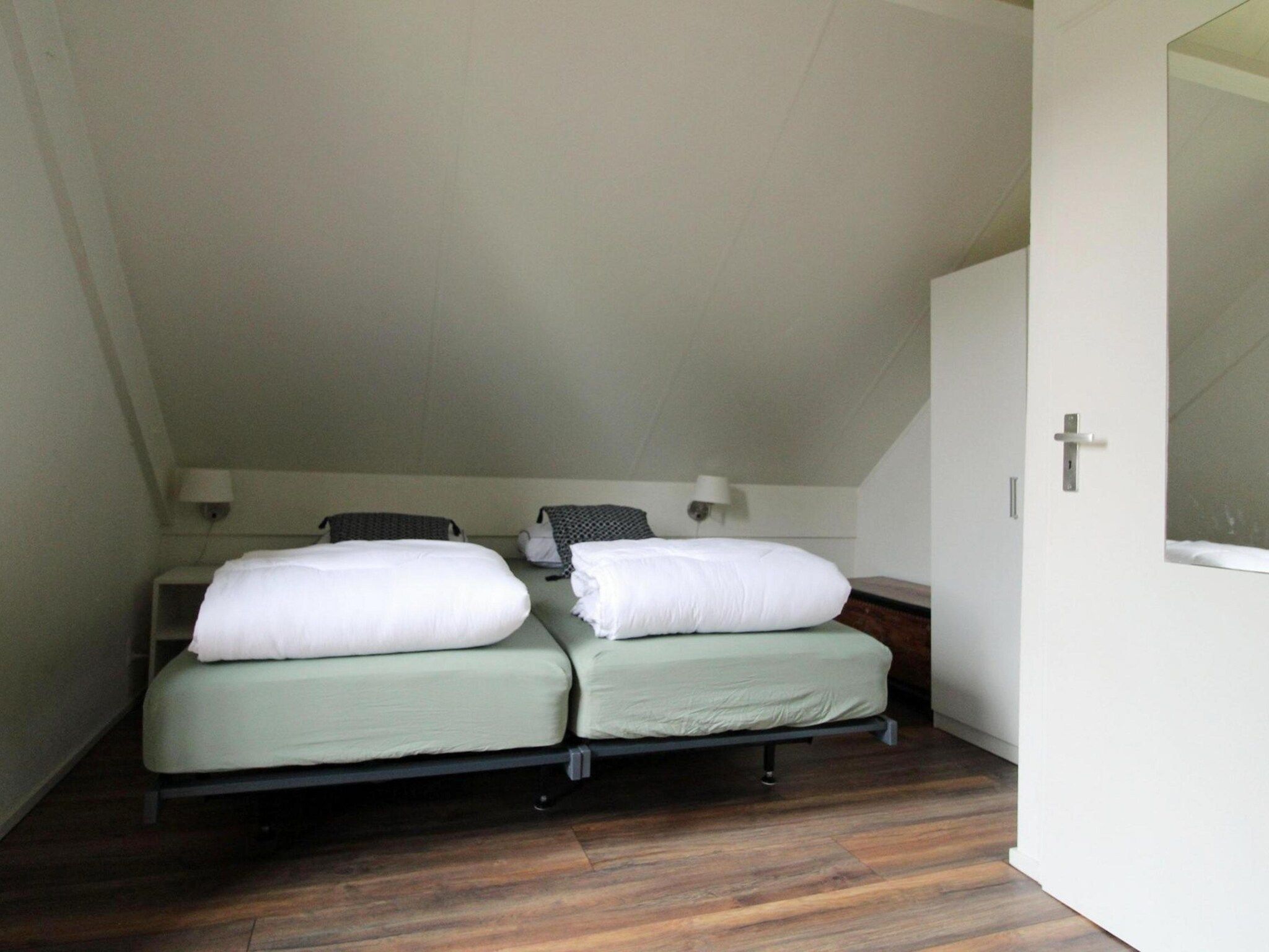 Een slaapkamer van 6 - Persons Bungalow La Moufflon in Ewijk