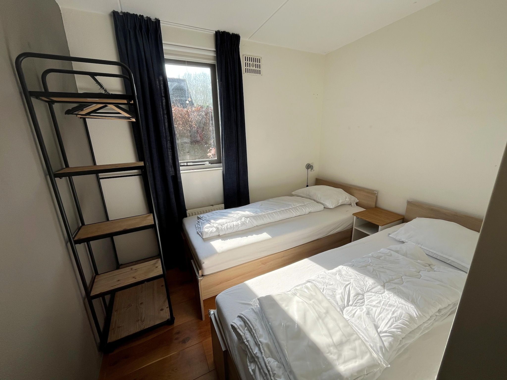 Een slaapkamer van 6 - Person Forest Pet & Family Bungalow in Ewijk