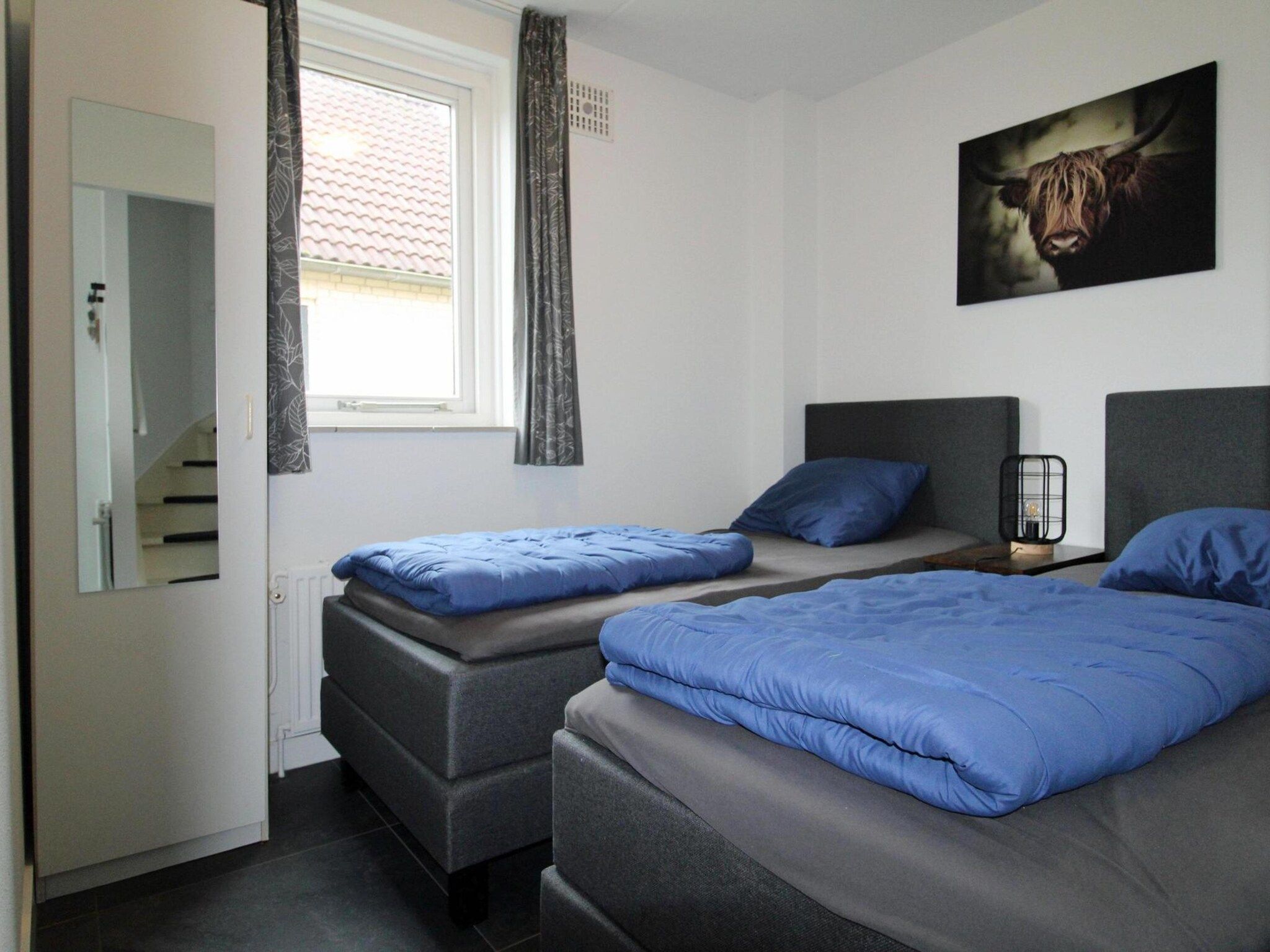 Een slaapkamer van 6 - Person Forest 28 Bungalow in Ewijk