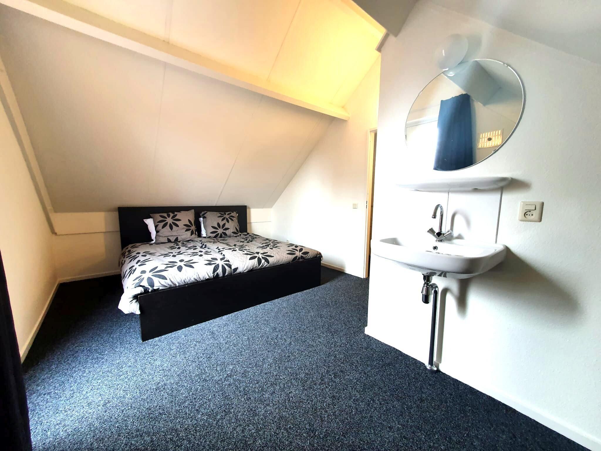 Een slaapkamer van 5 - Person Forest 10 Bungalow in Ewijk