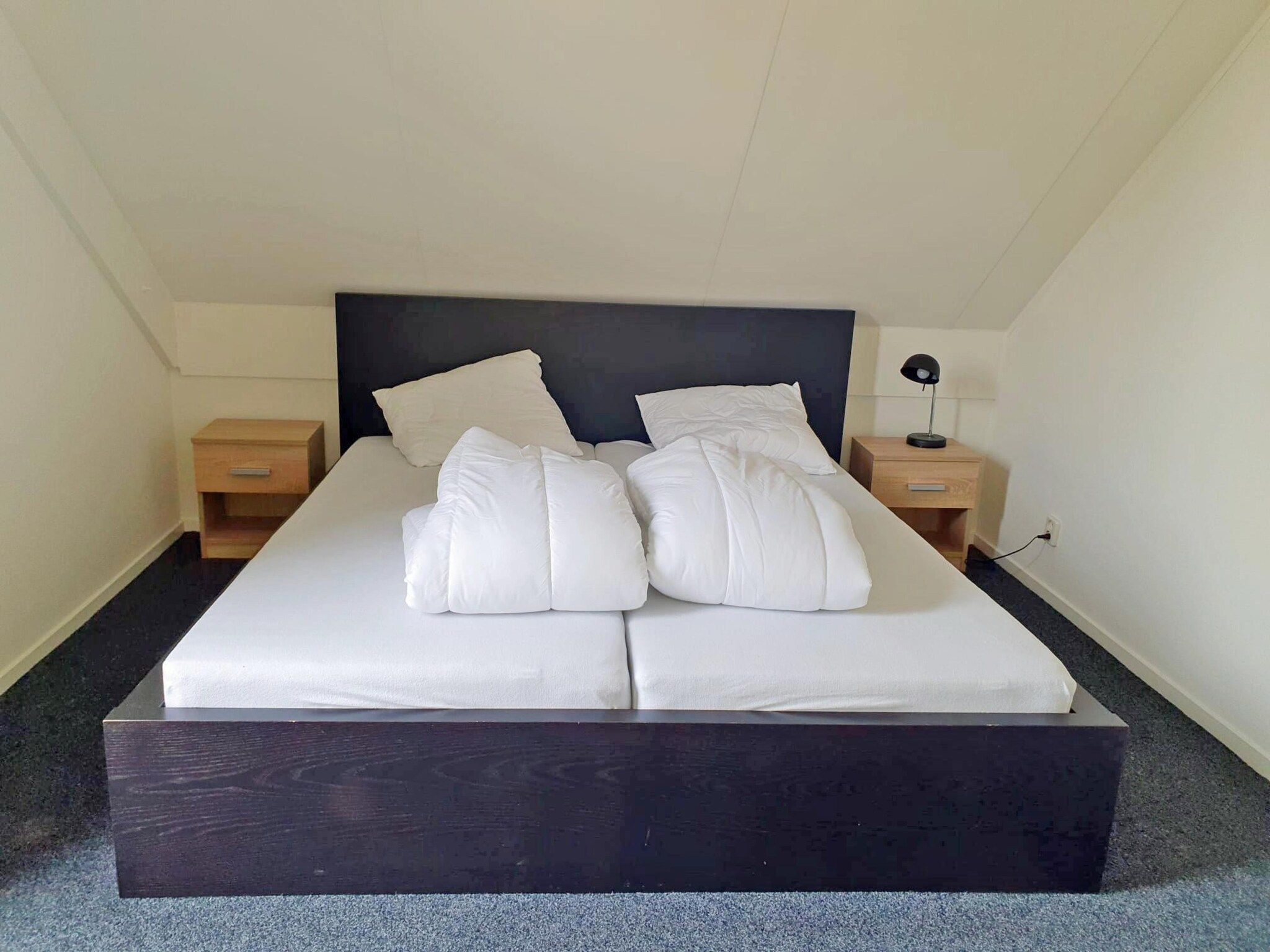 Een slaapkamer van 5 - Person Forest 10 Bungalow in Ewijk