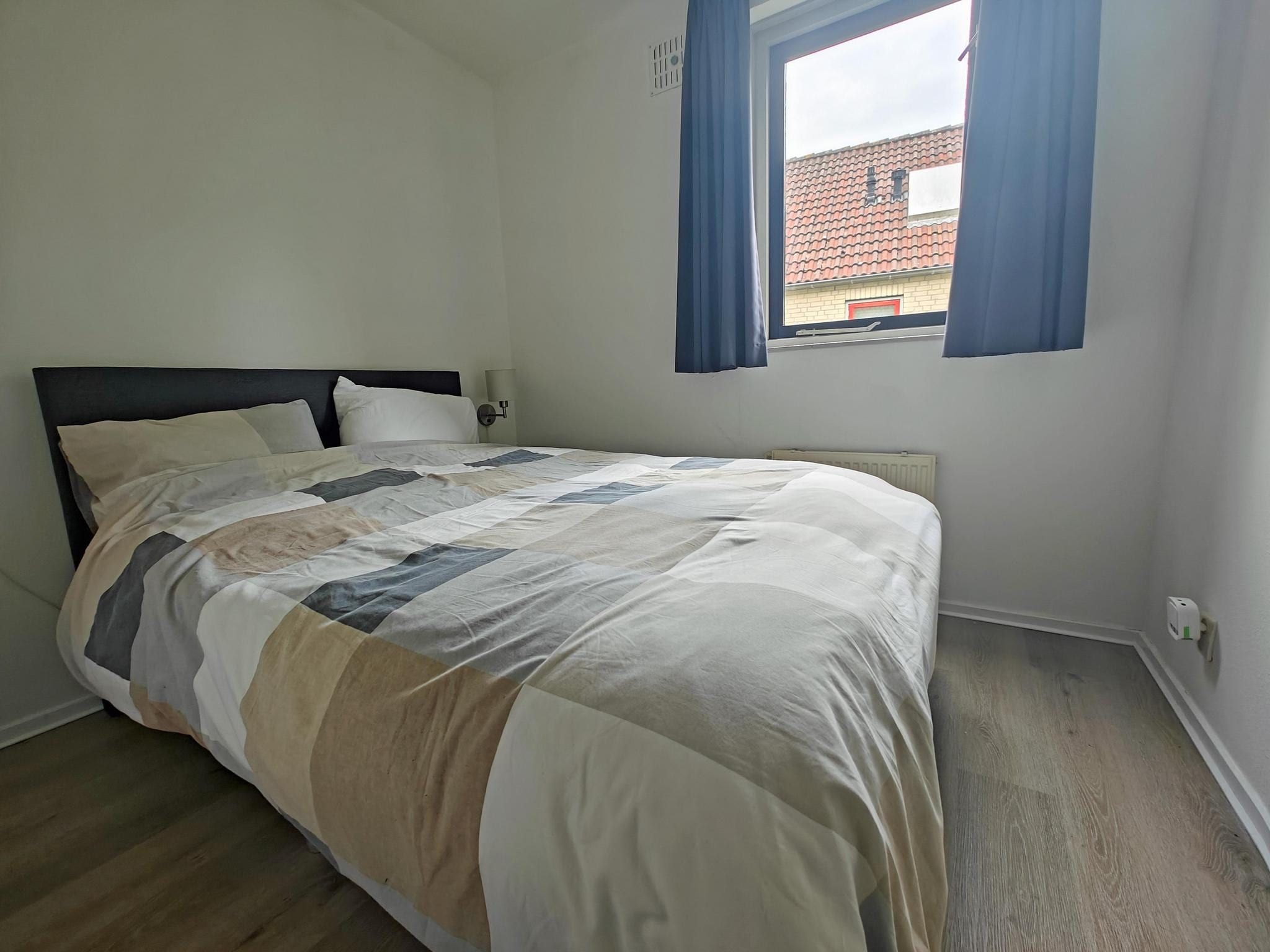 Een slaapkamer van 4 - Persons Lakeside Bungalow (copy) (copy) in Ewijk