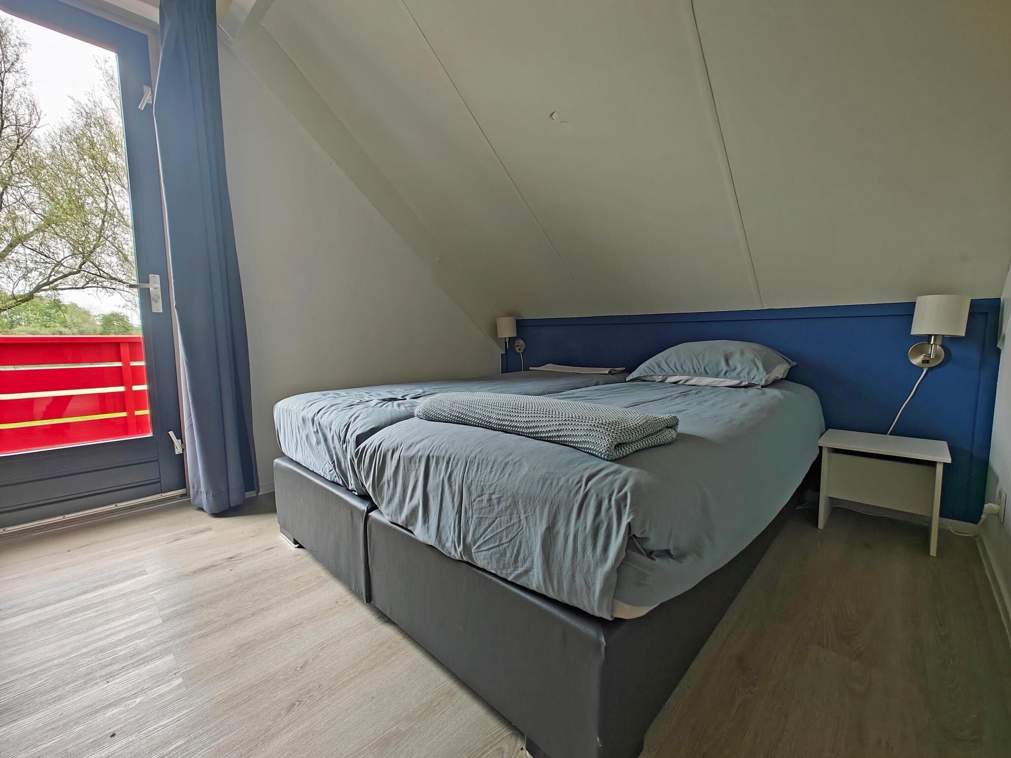 Een slaapkamer van 4 - Persons Lakeside Bungalow (copy) (copy) in Ewijk