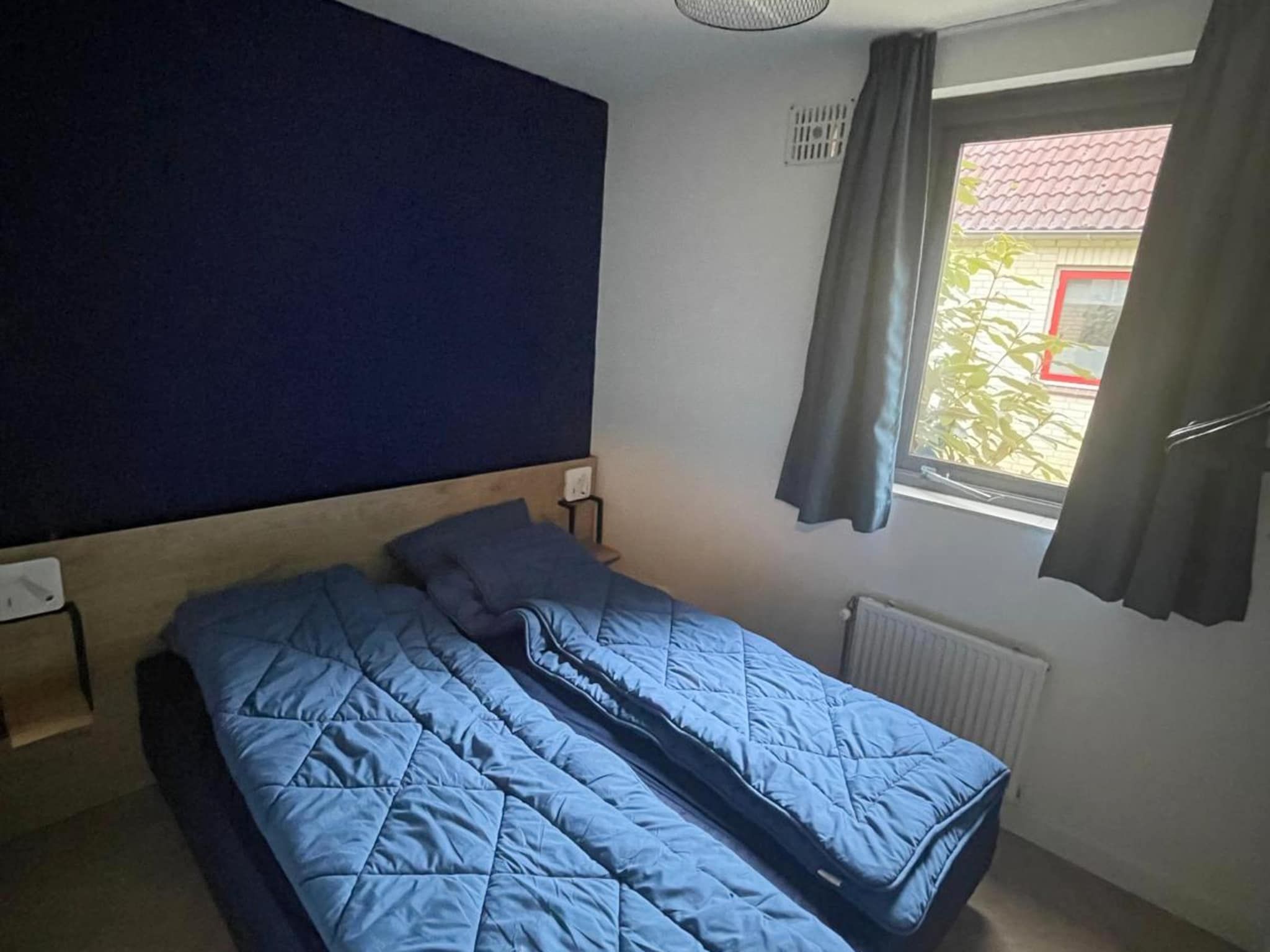 Een slaapkamer van 6 - Persons Lakeside Bungalow (copy) in Ewijk