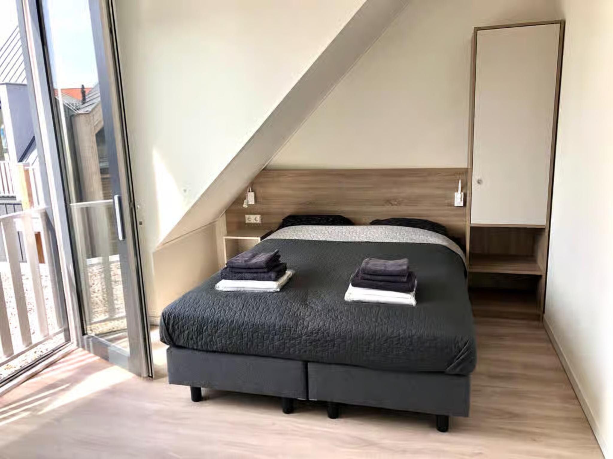 Een slaapkamer van Plein 40 Lodge 6 in Zoutelande