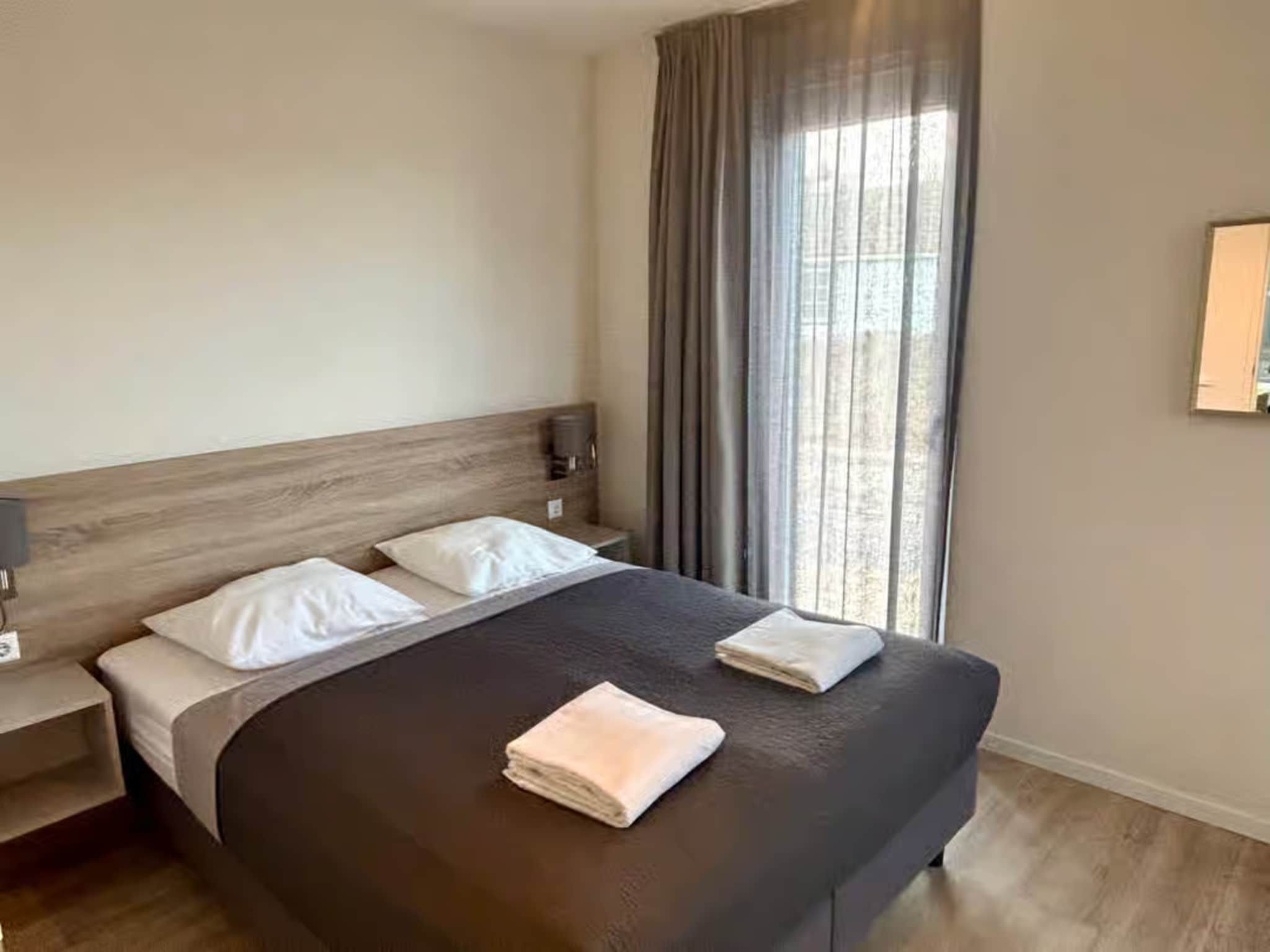 Een slaapkamer van Plein 40 Lodge 26 in Zoutelande