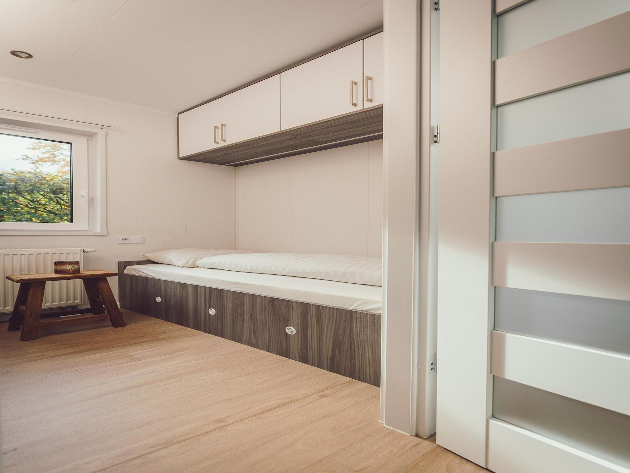 Een slaapkamer van Tiny Cabin with Hottub I 4 people in Rijssen