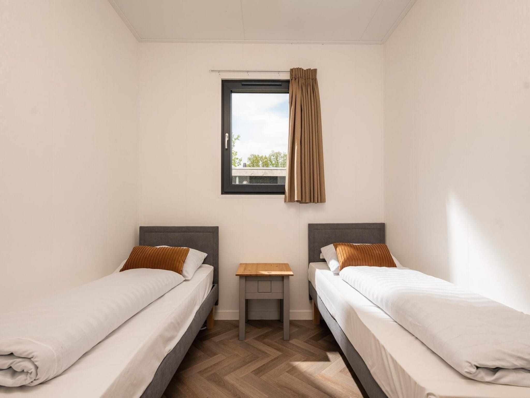 Een slaapkamer van Oak Lodge I 4 people in Rijssen