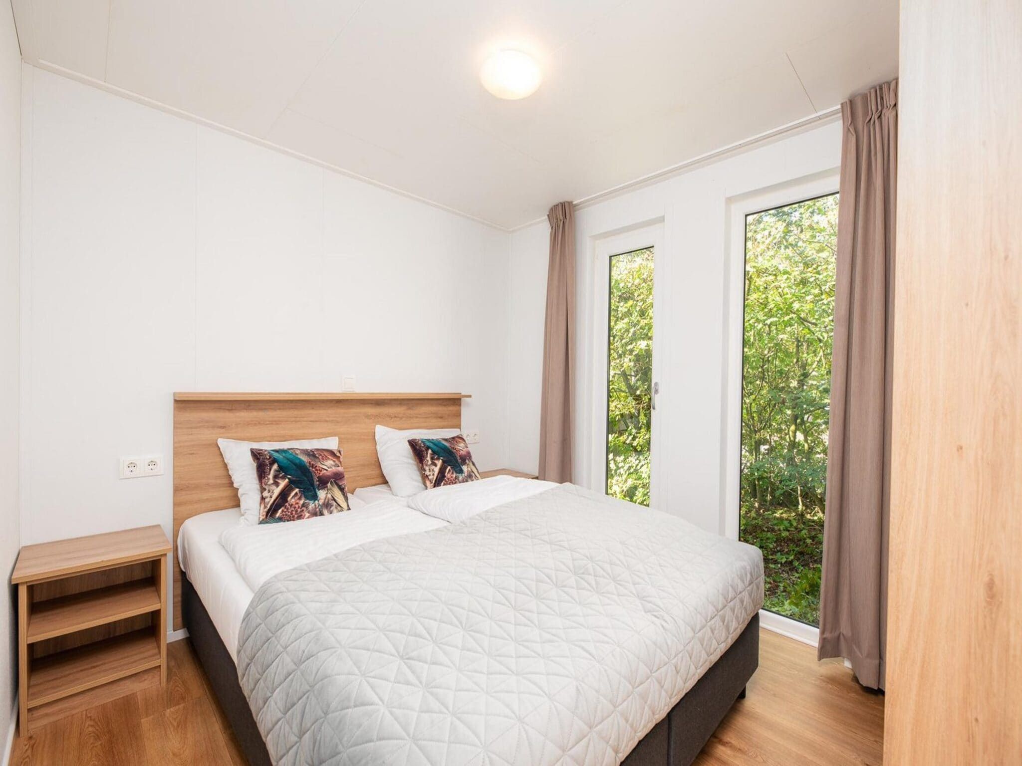 Een slaapkamer van River Cabin with hot tub | 6 people in Zuna