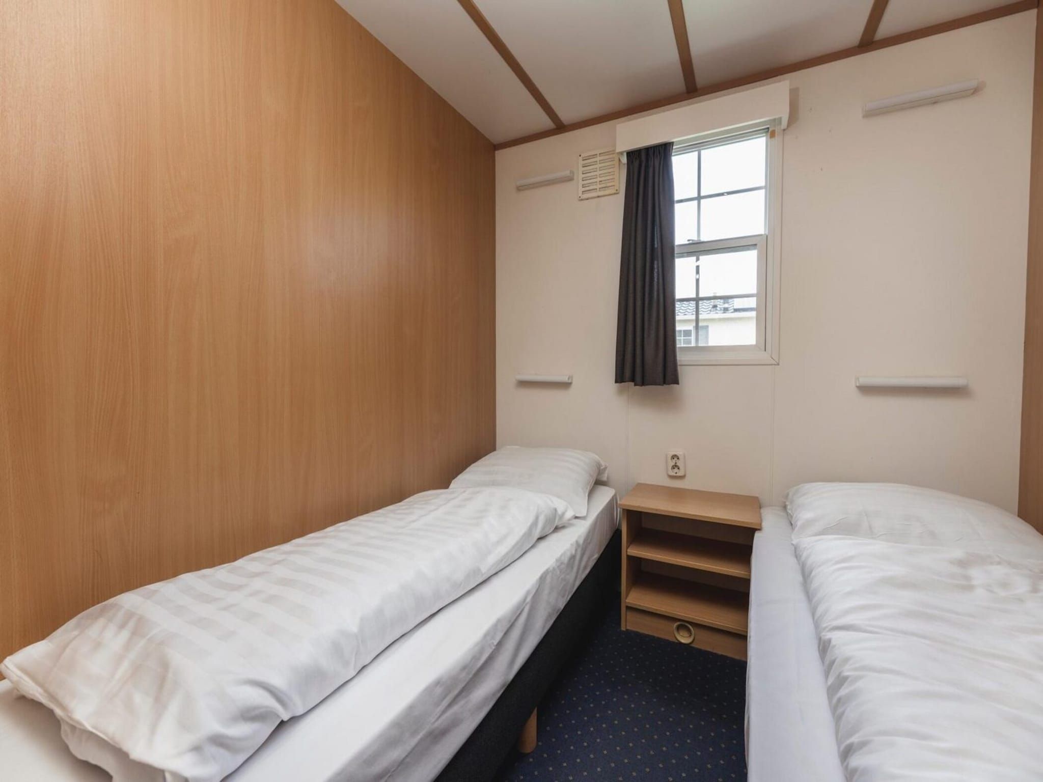 Een slaapkamer van Bungalow near the river I 4 persons in Zuna