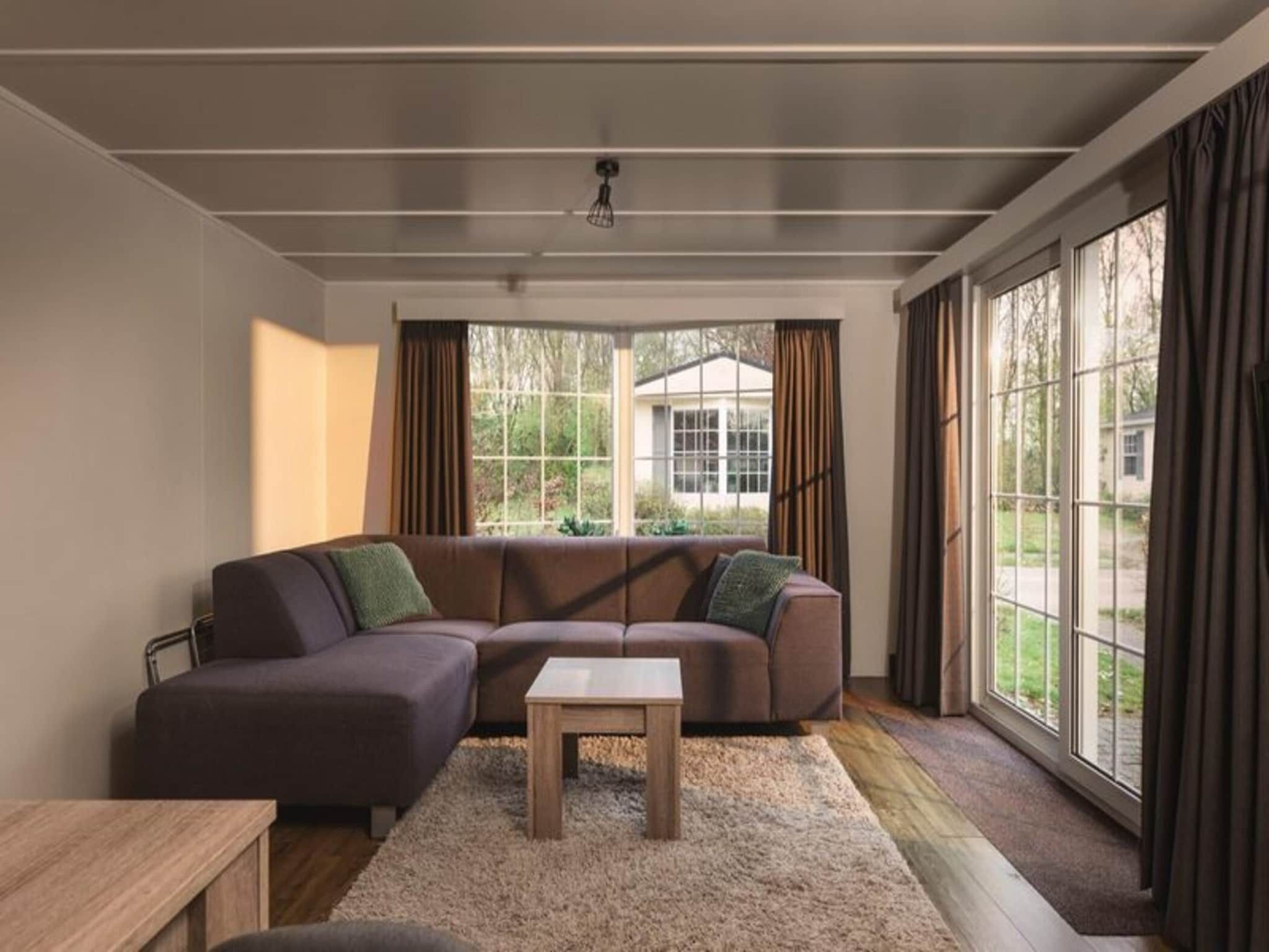 De woonkamer van Bungalow near the river I 4 persons in Zuna