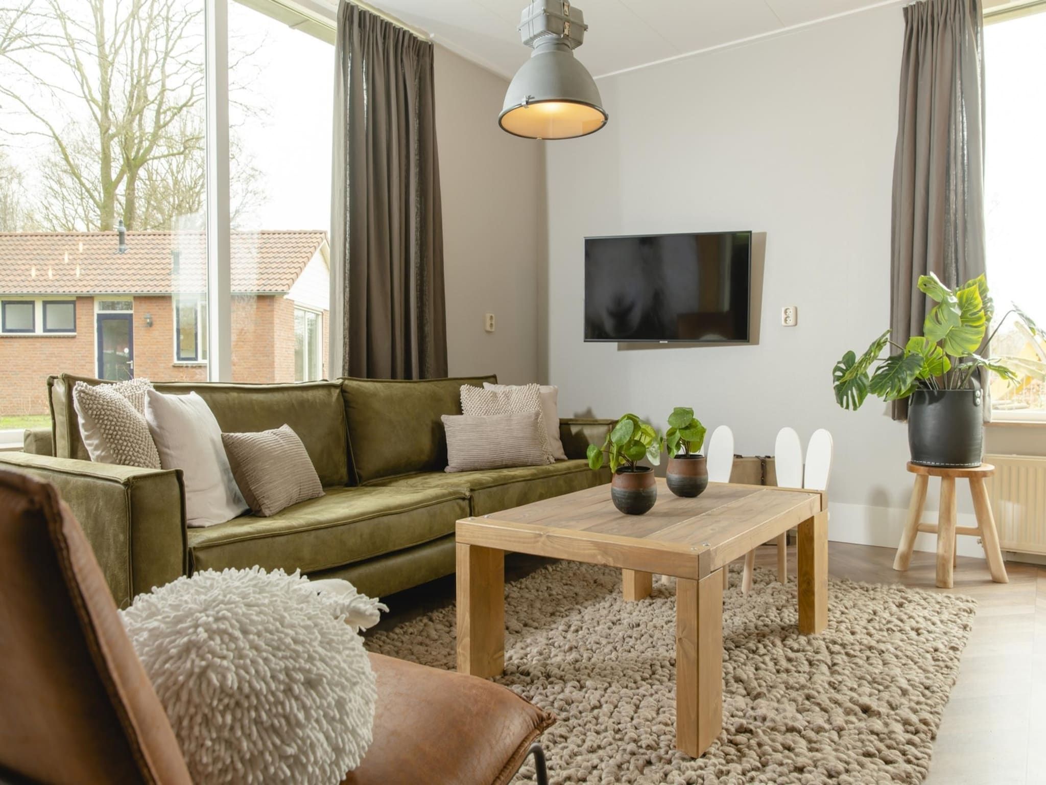De woonkamer van Baby & children bungalow with bubble tub I 5 persons in Zuna