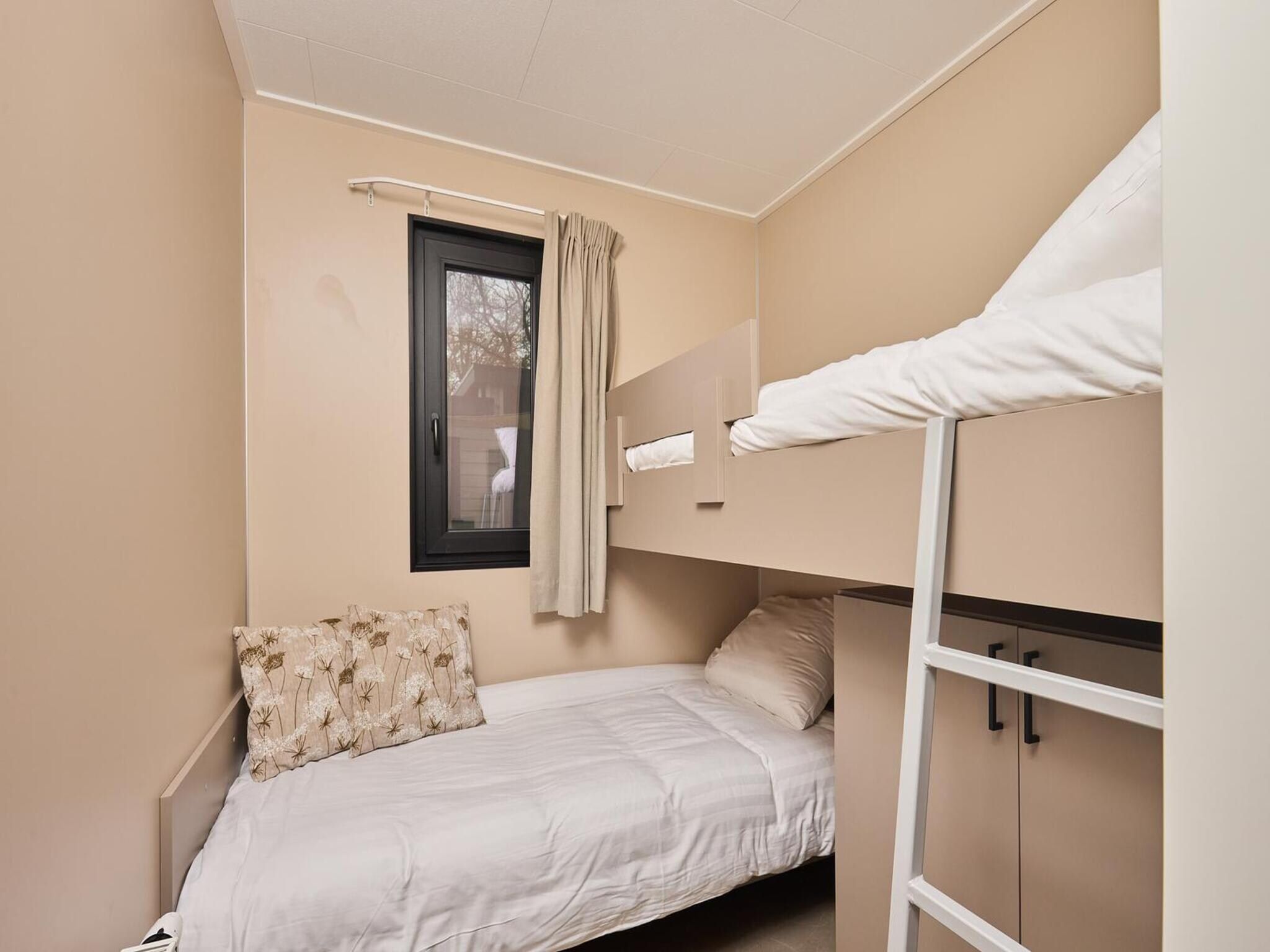 Een slaapkamer van Wellness Boutique baby | 4 people + baby room in Zuna