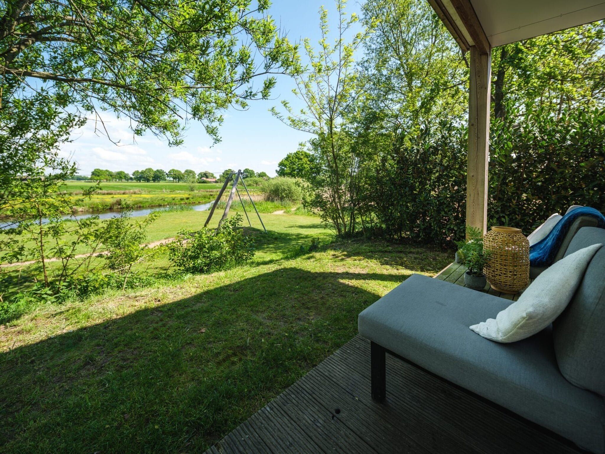 Het uitzicht vanaf River Lodge 'Wellnesshuus' with whirlpool, sauna, bathtub, and sun shower | 2 people in Zuna