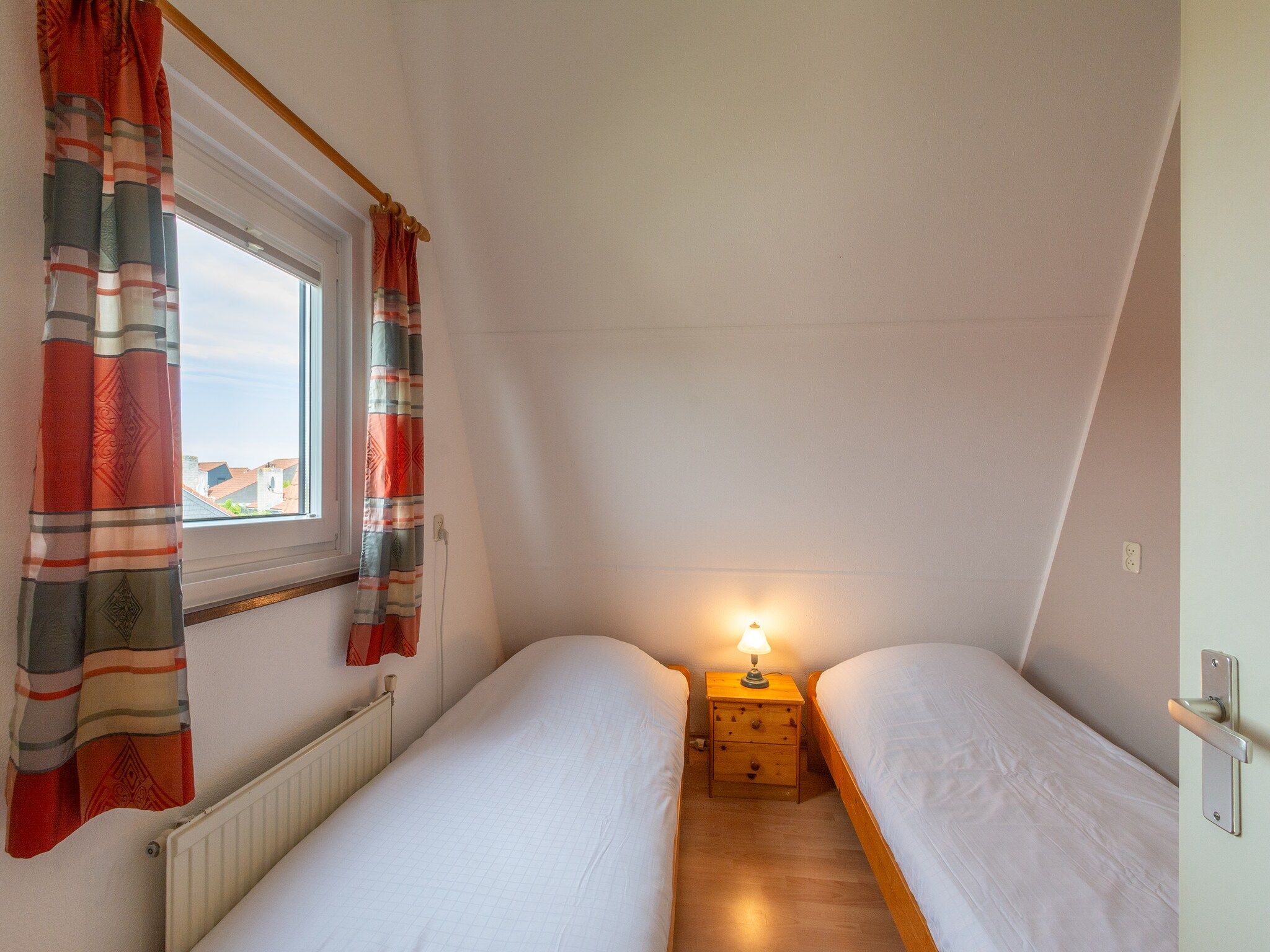 Een slaapkamer van Yperhof 3 in Julianadorp aan Zee