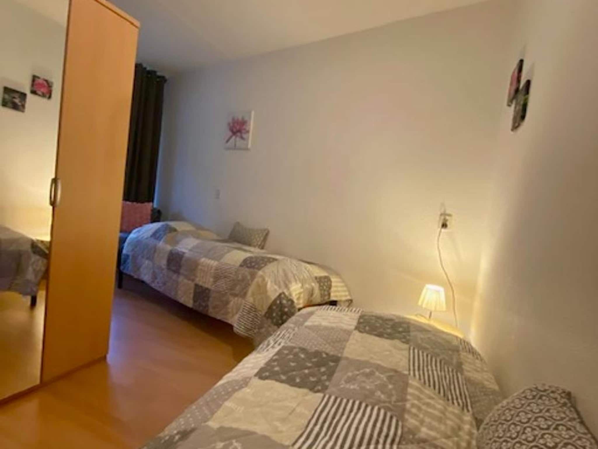 Een slaapkamer van Résidence Juliana 21 in Julianadorp aan Zee