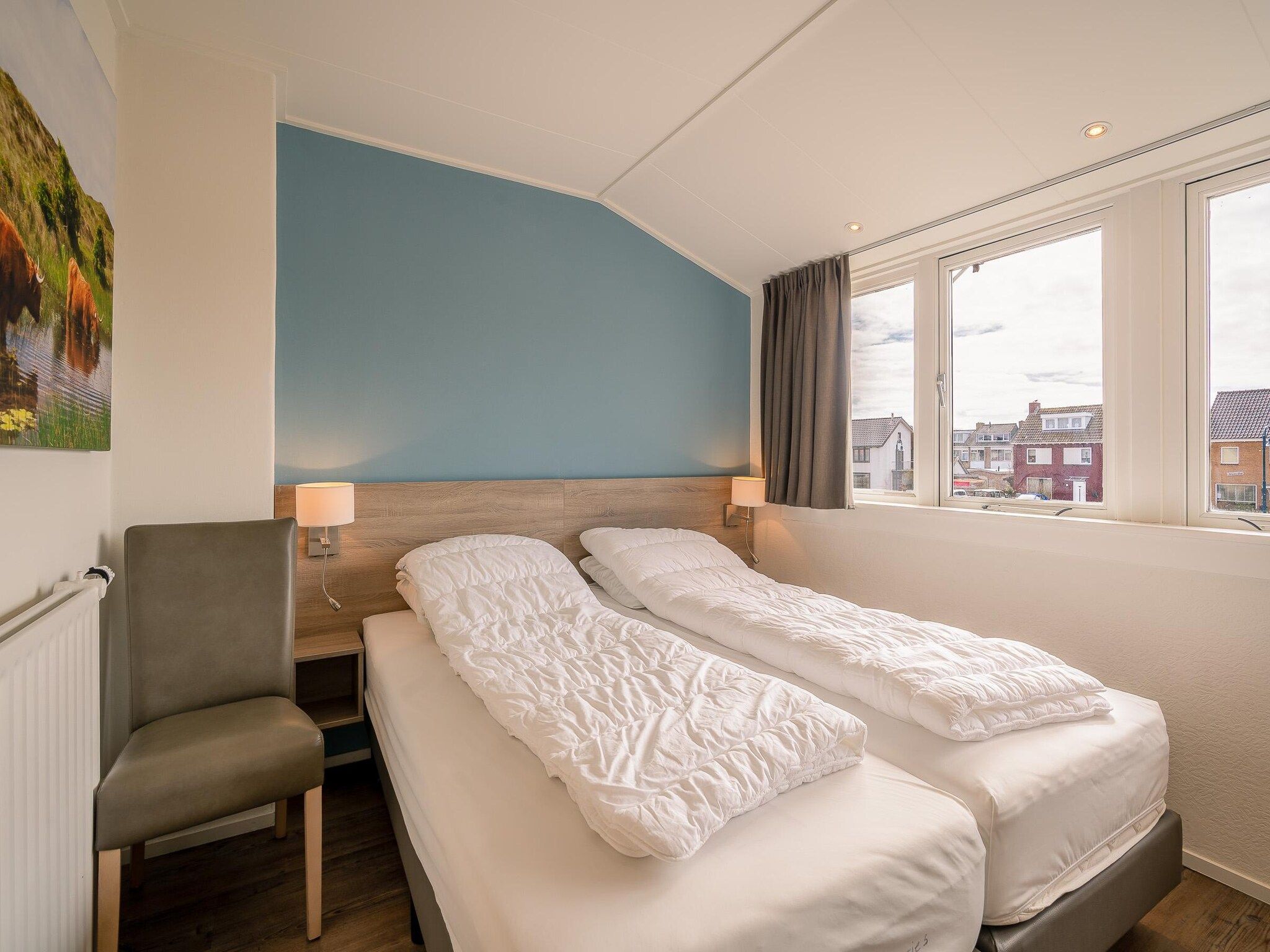 Een slaapkamer van Brink 24 - De Bosruiter in De Koog