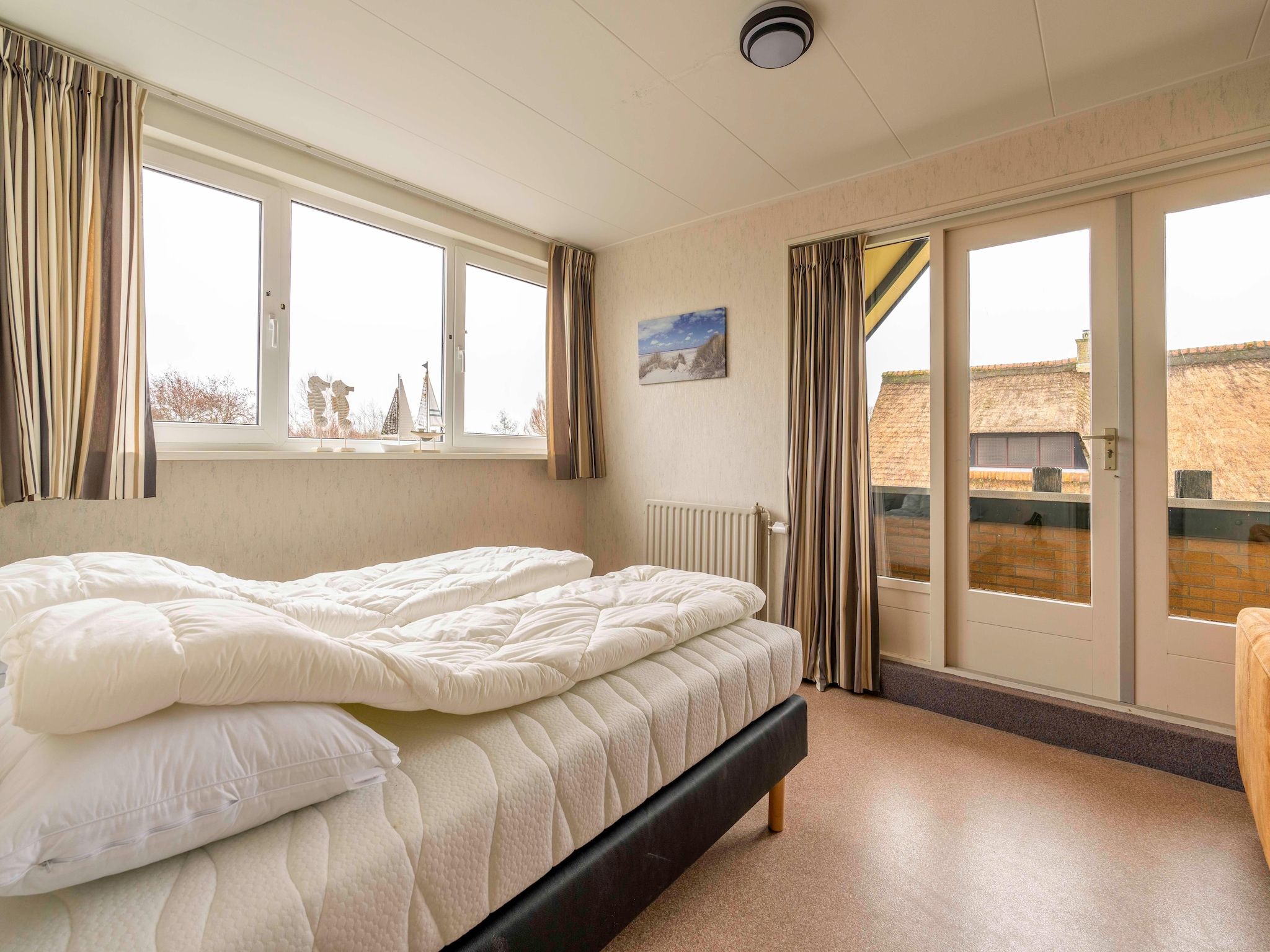 Een slaapkamer van Ruijslaan 69 - Huis Ter Duin in De Koog