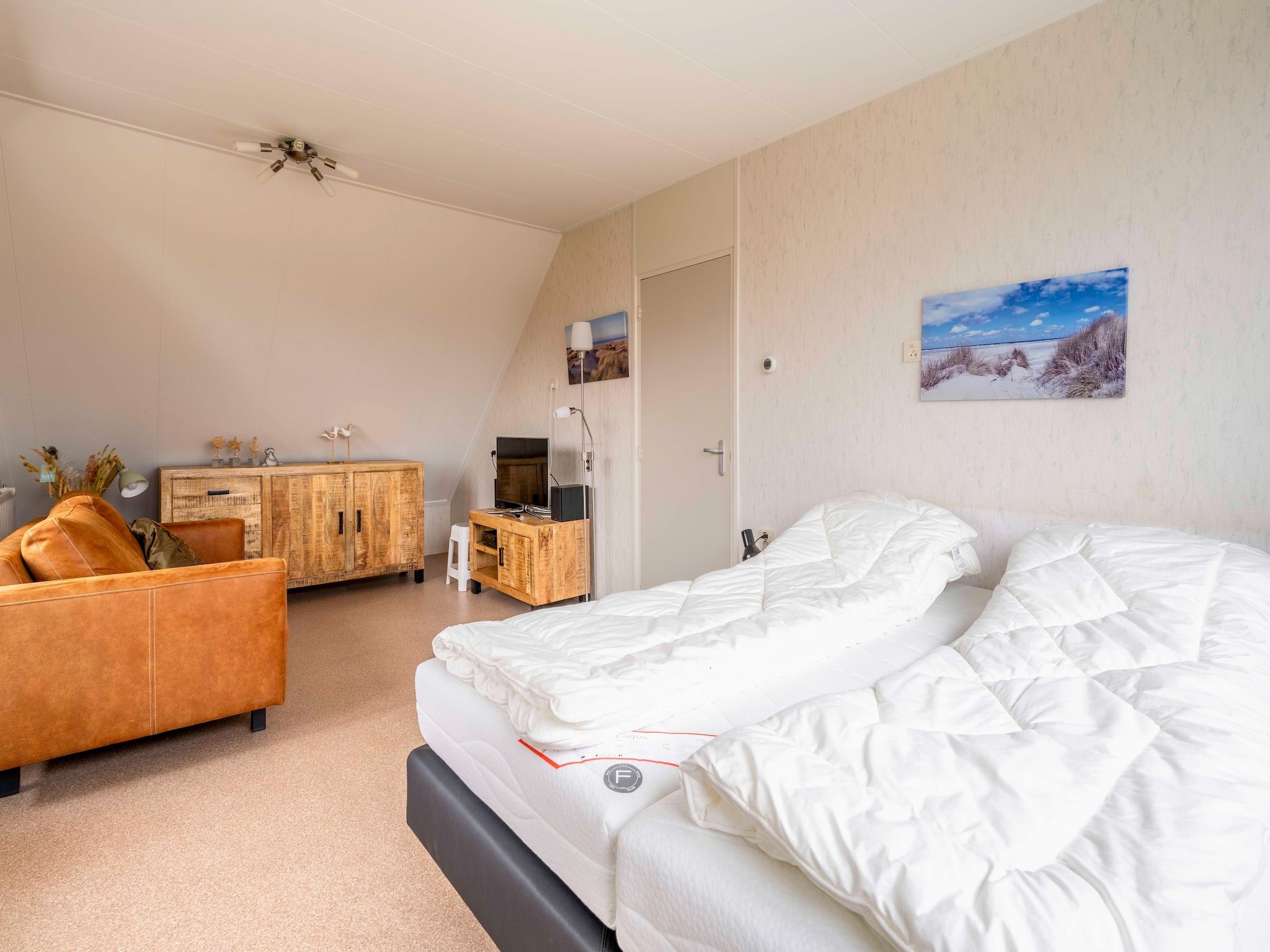 Een slaapkamer van Ruijslaan 69 - Huis Ter Duin in De Koog