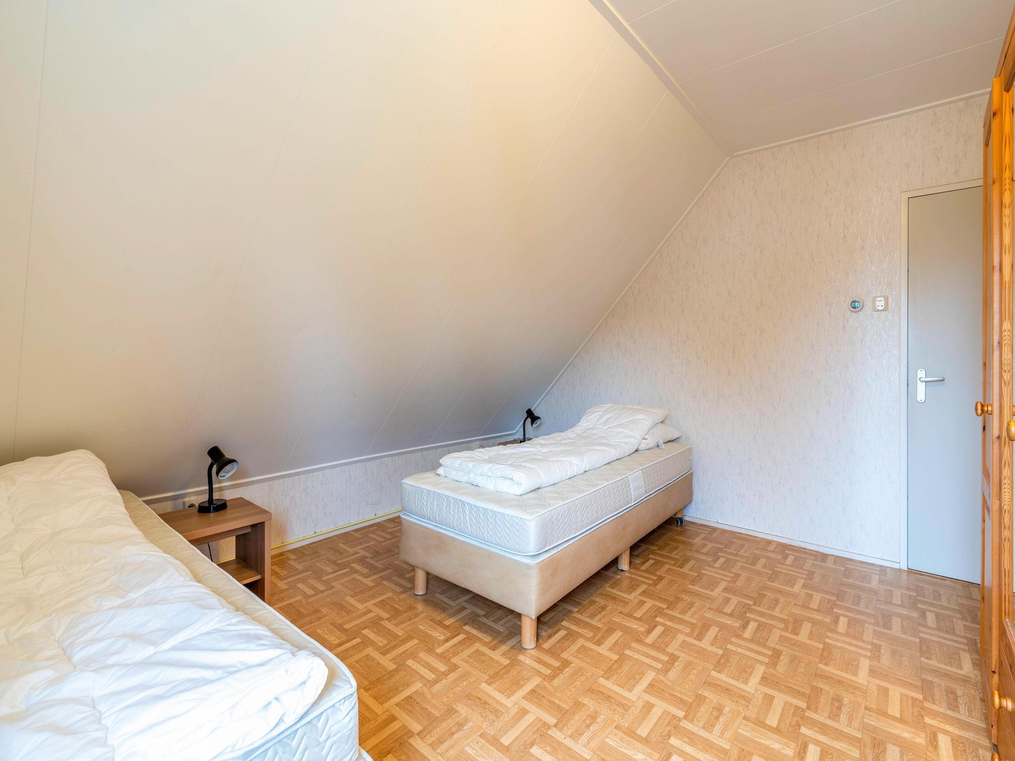 Een slaapkamer van Ruijslaan 69 - Huis Ter Duin in De Koog