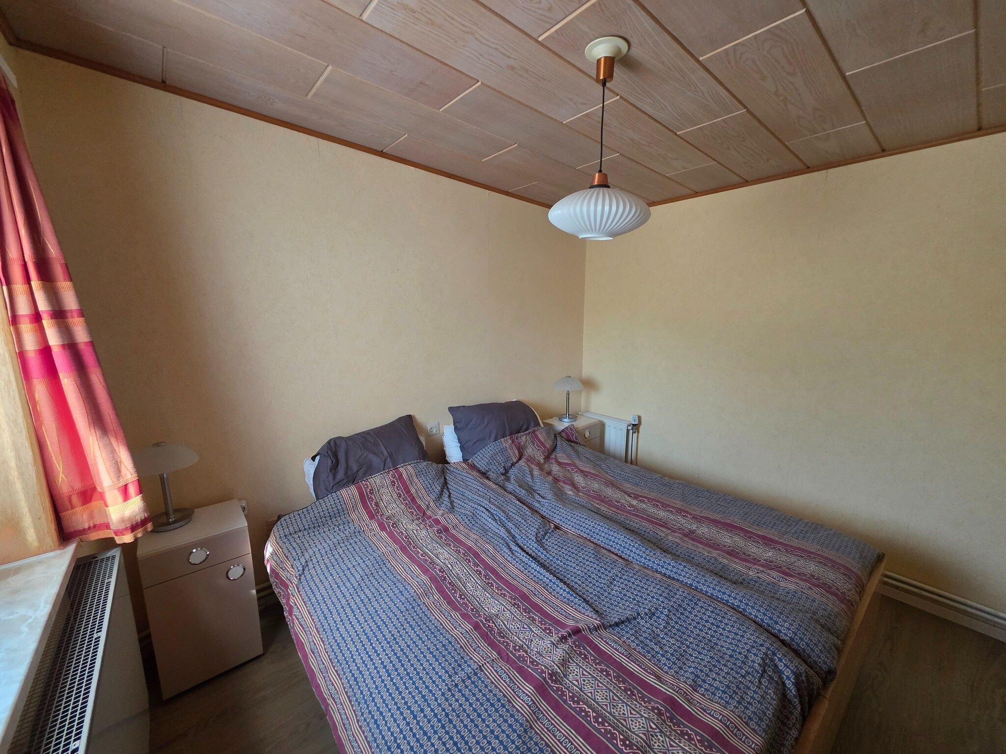 Een slaapkamer van Pelikaanweg 47 - Moha in De Koog