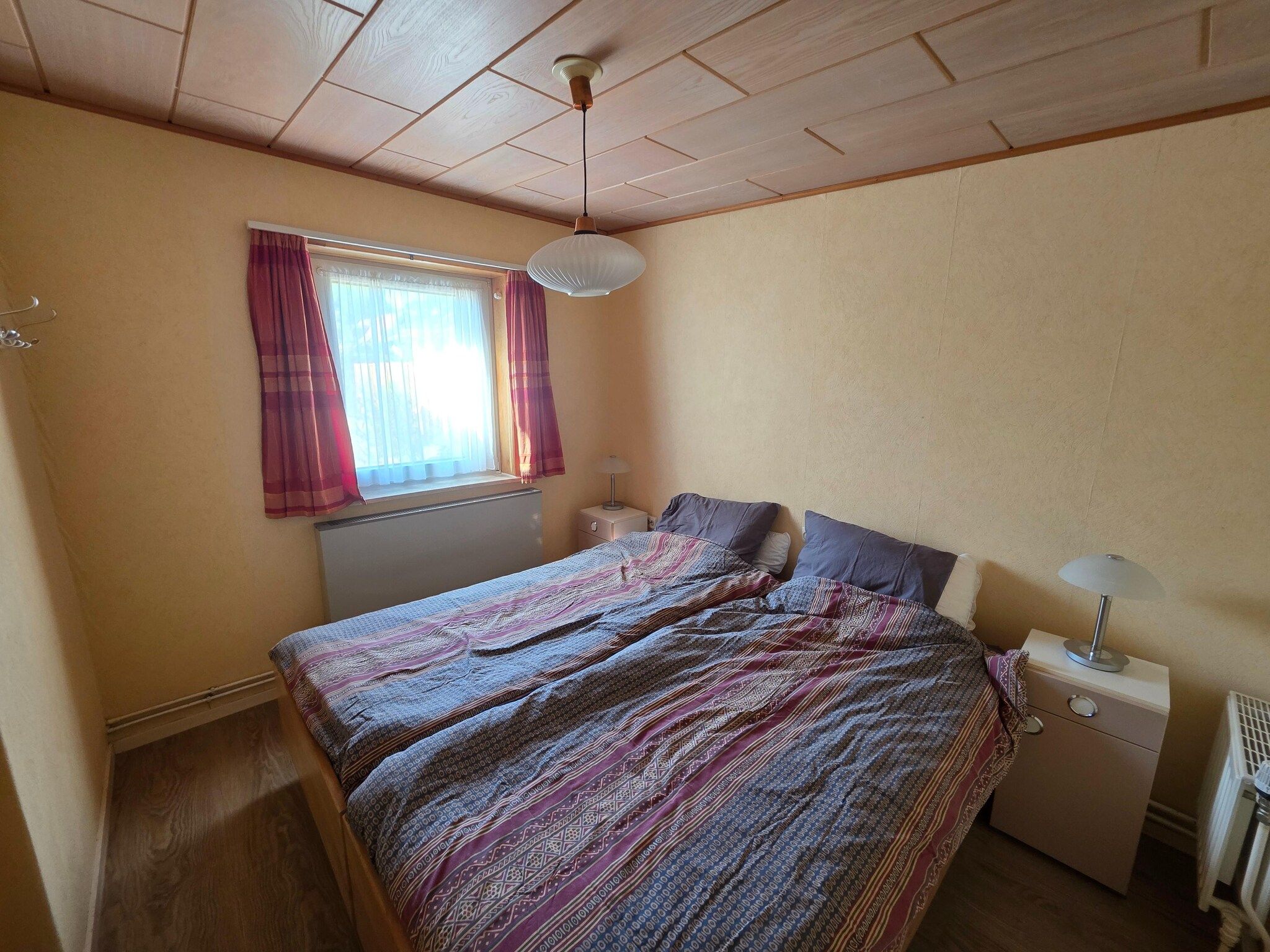 Een slaapkamer van Pelikaanweg 47 - Moha in De Koog