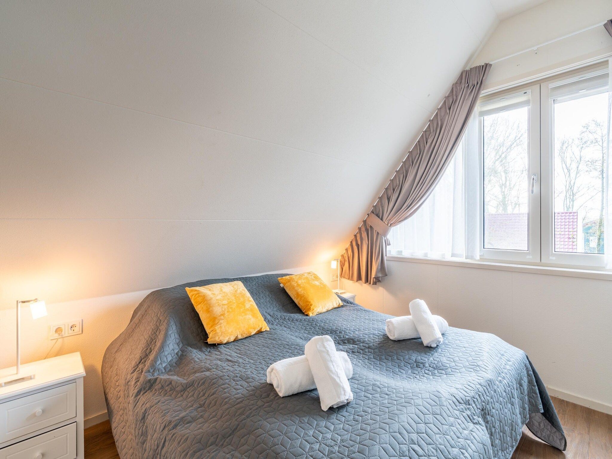 Een slaapkamer van Het oude dijkje in De Koog