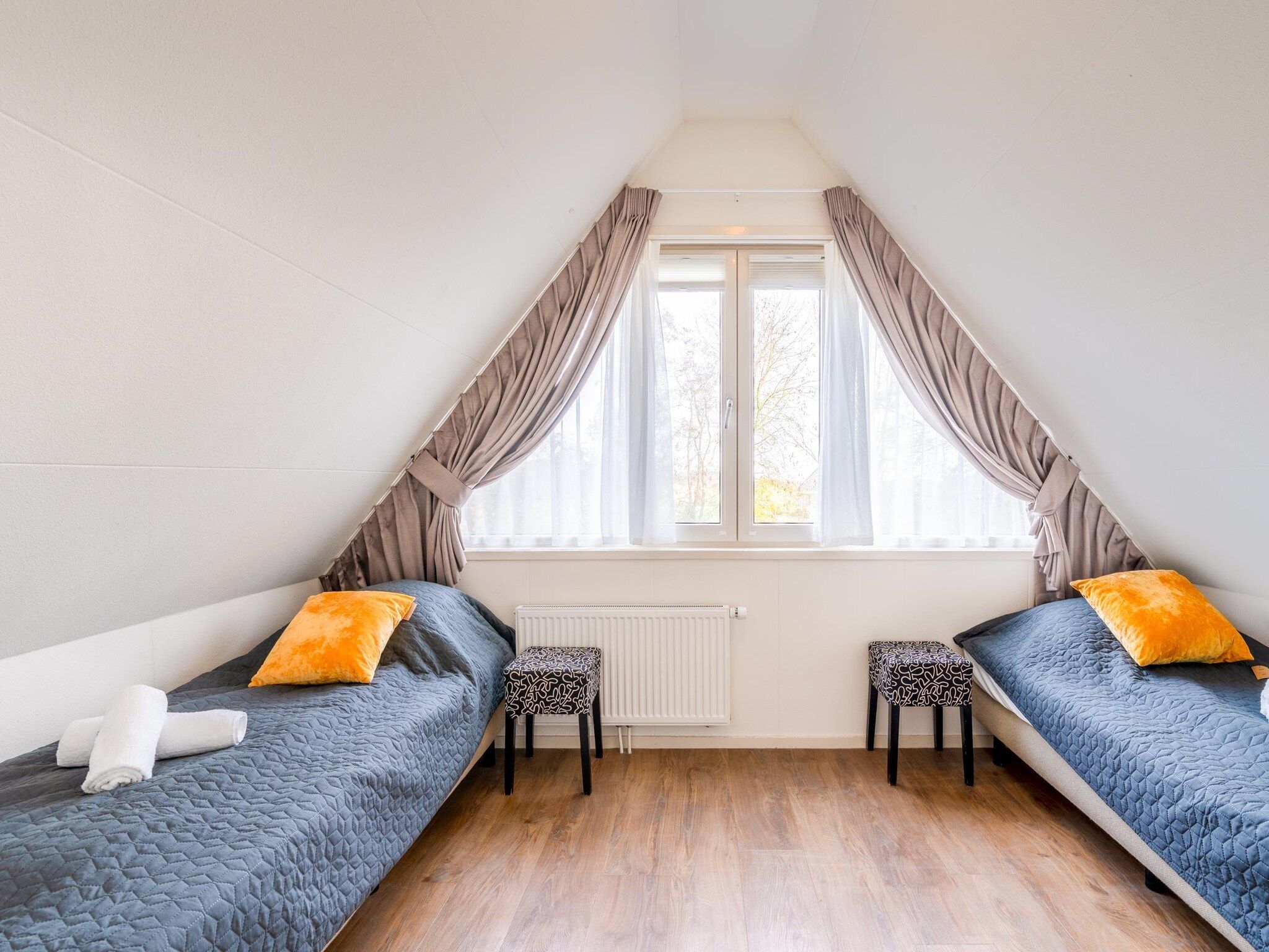 Een slaapkamer van Het oude dijkje in De Koog