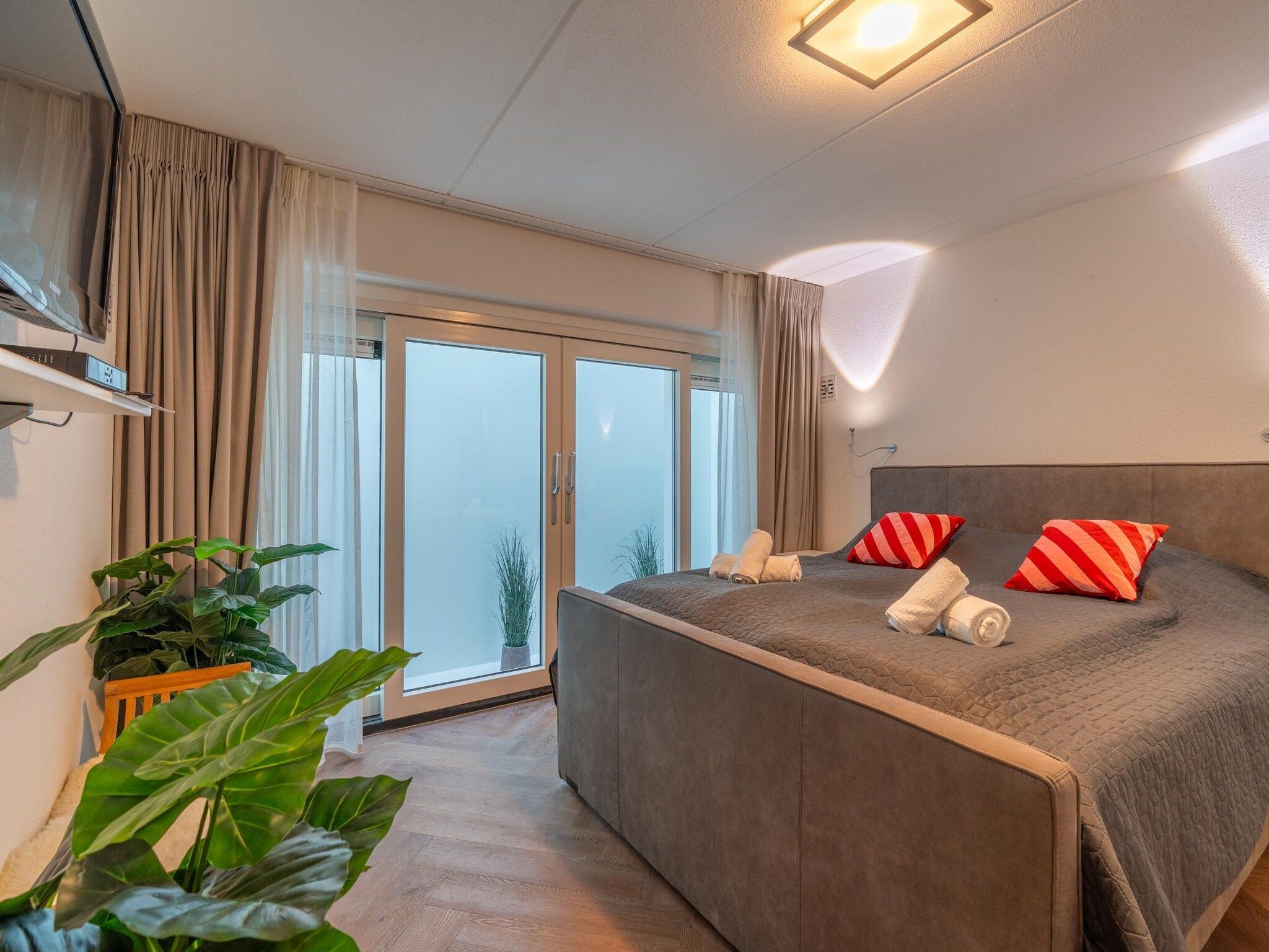 Een slaapkamer van Het oude dijkje in De Koog