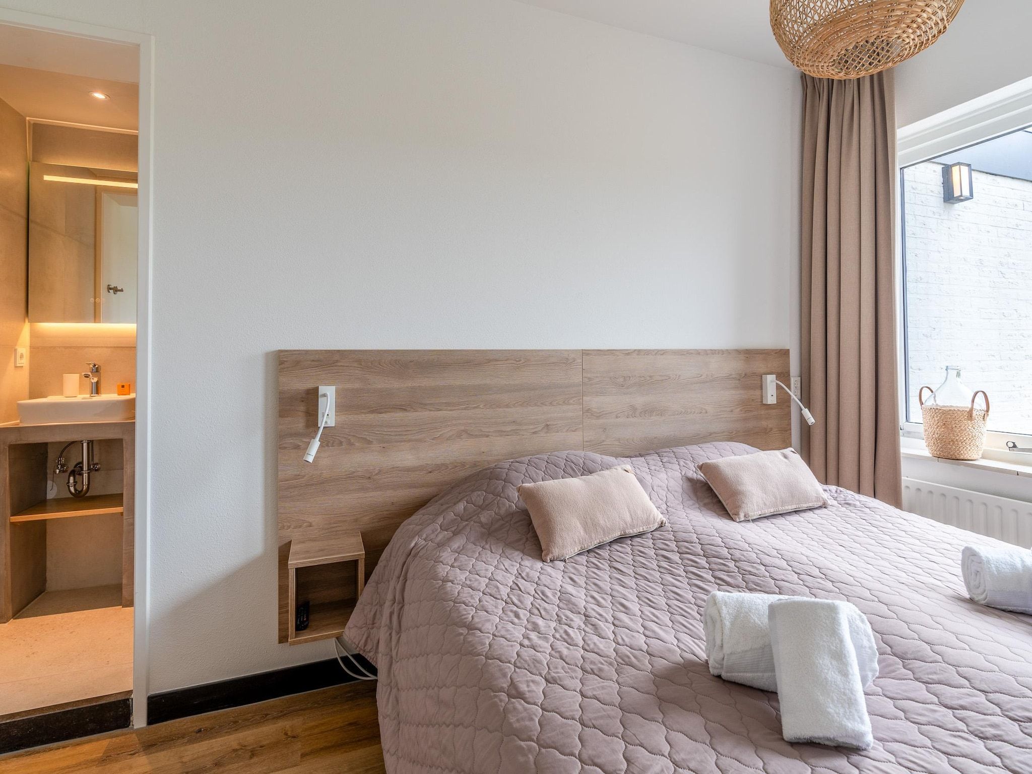 Een slaapkamer van Orchismient 17 in De Koog